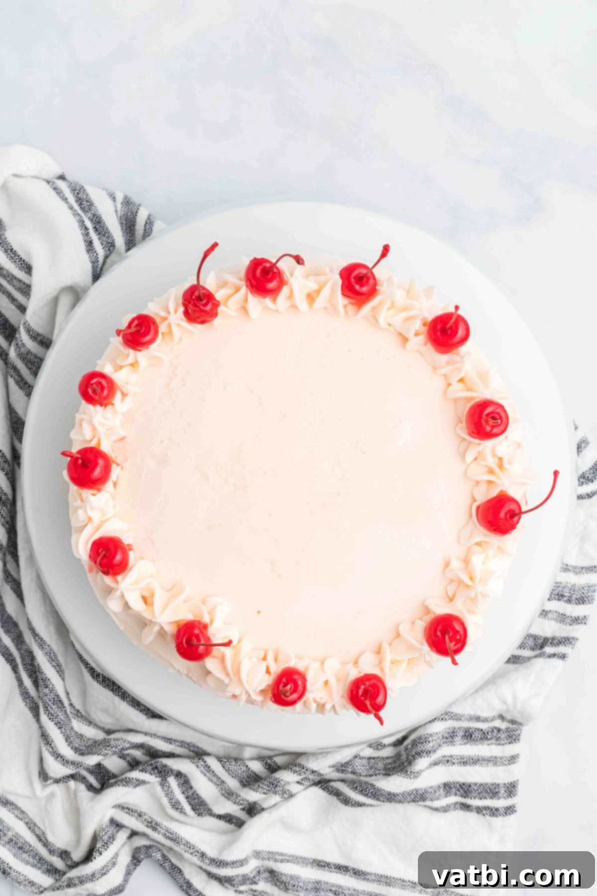 Perfect Cherry Chip Cake 14 Whole Maraschino cherries arranged on top of the frosted cherry chip cake.