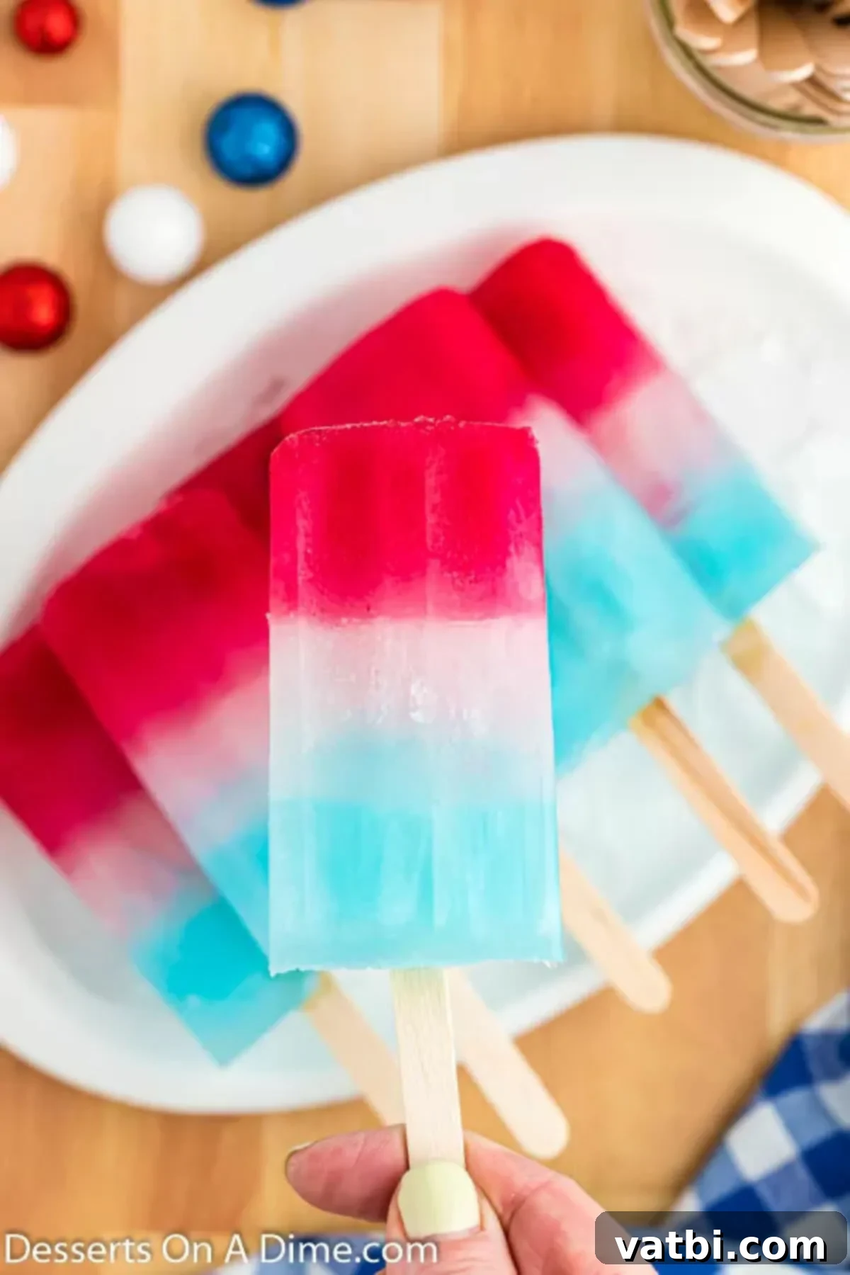 Red, White, and Blue: A Sweet Summer Celebration 2 Red white and blue popsicles on a tray.