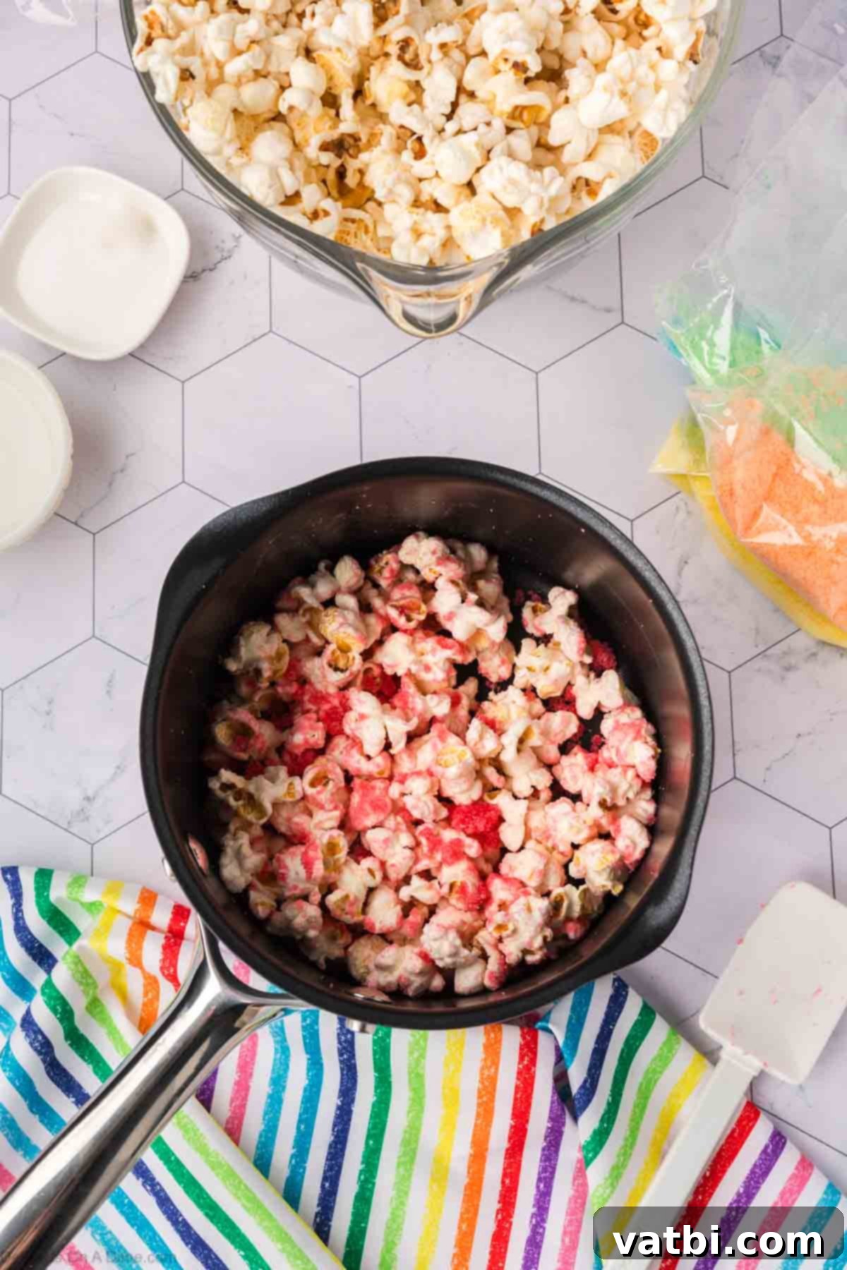 Kaleidoscope Popcorn 11 Popcorn added to the sugar mixture.