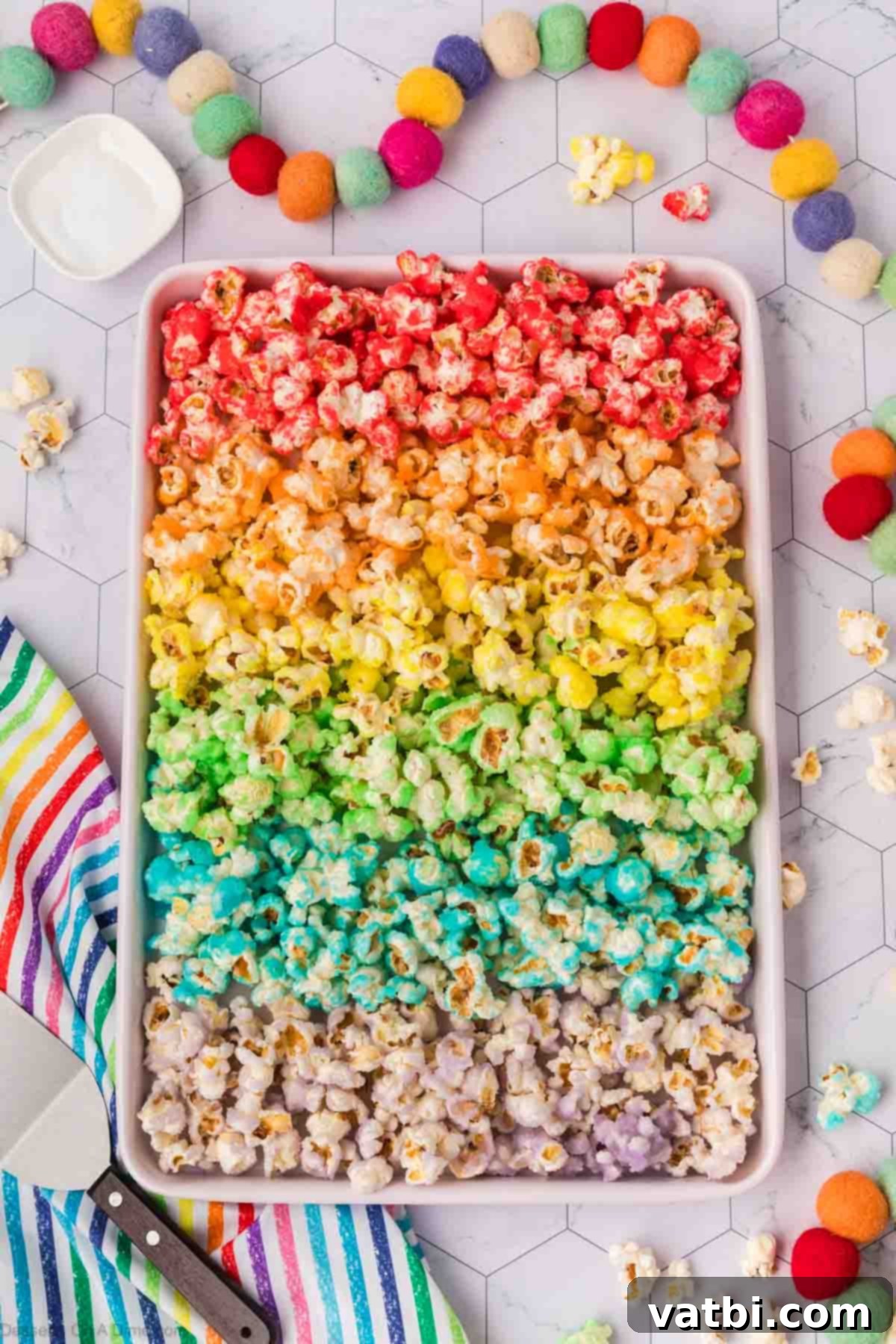 Kaleidoscope Popcorn 13 Popcorn spread on baking sheet in different colors.