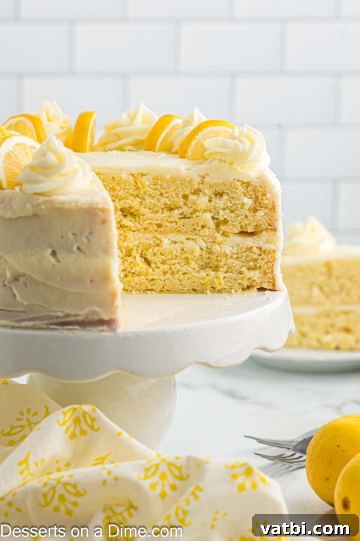 Sun-Kissed Lemon Cake Delight 11 Cake on cake stand being sliced. A beautiful lemon cake, carefully sliced to reveal its delicious layers.