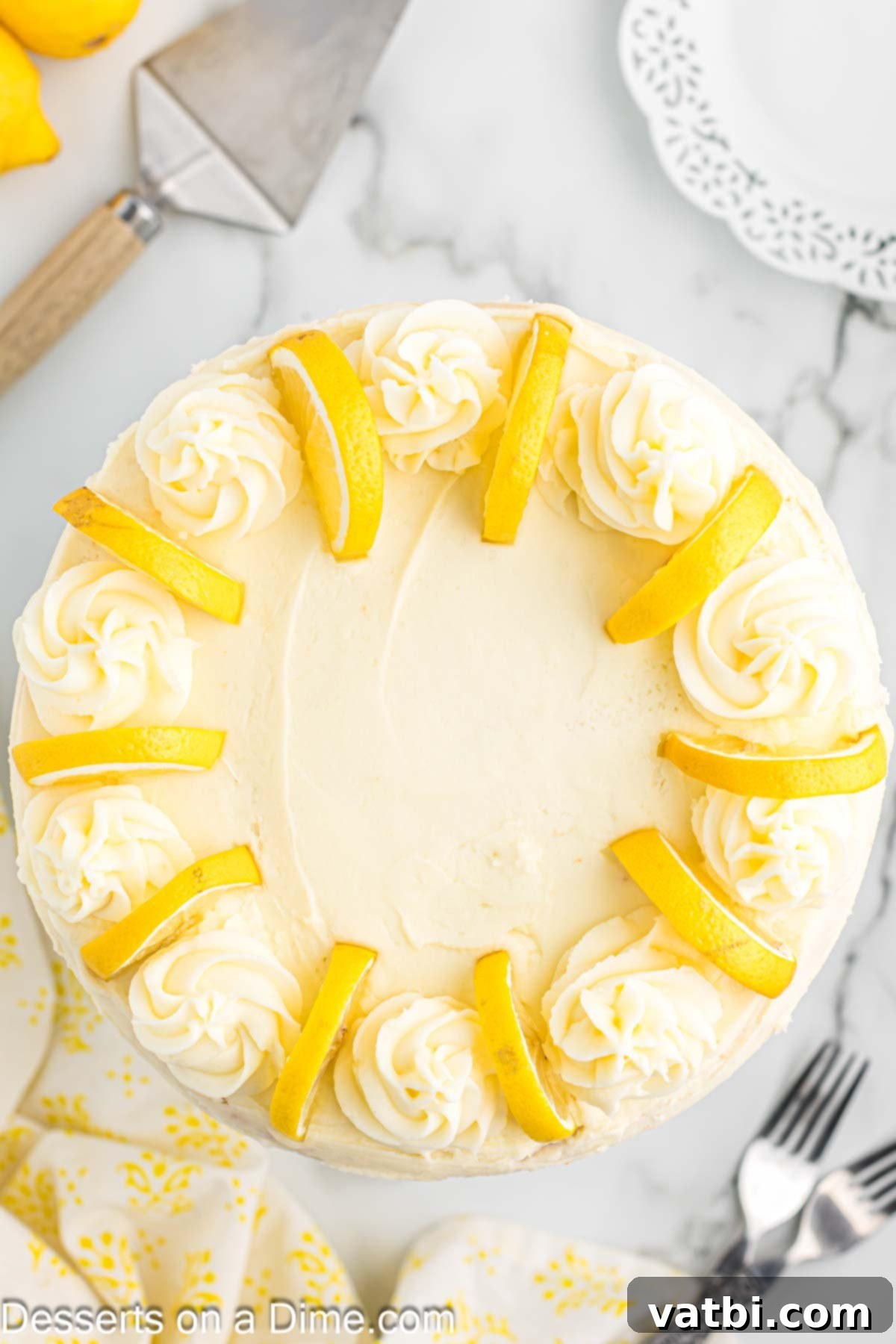Sun-Kissed Lemon Cake Delight 12 Photo of cake from overhead. An aerial view of a vibrant lemon cake, showcasing its beautiful frosting.
