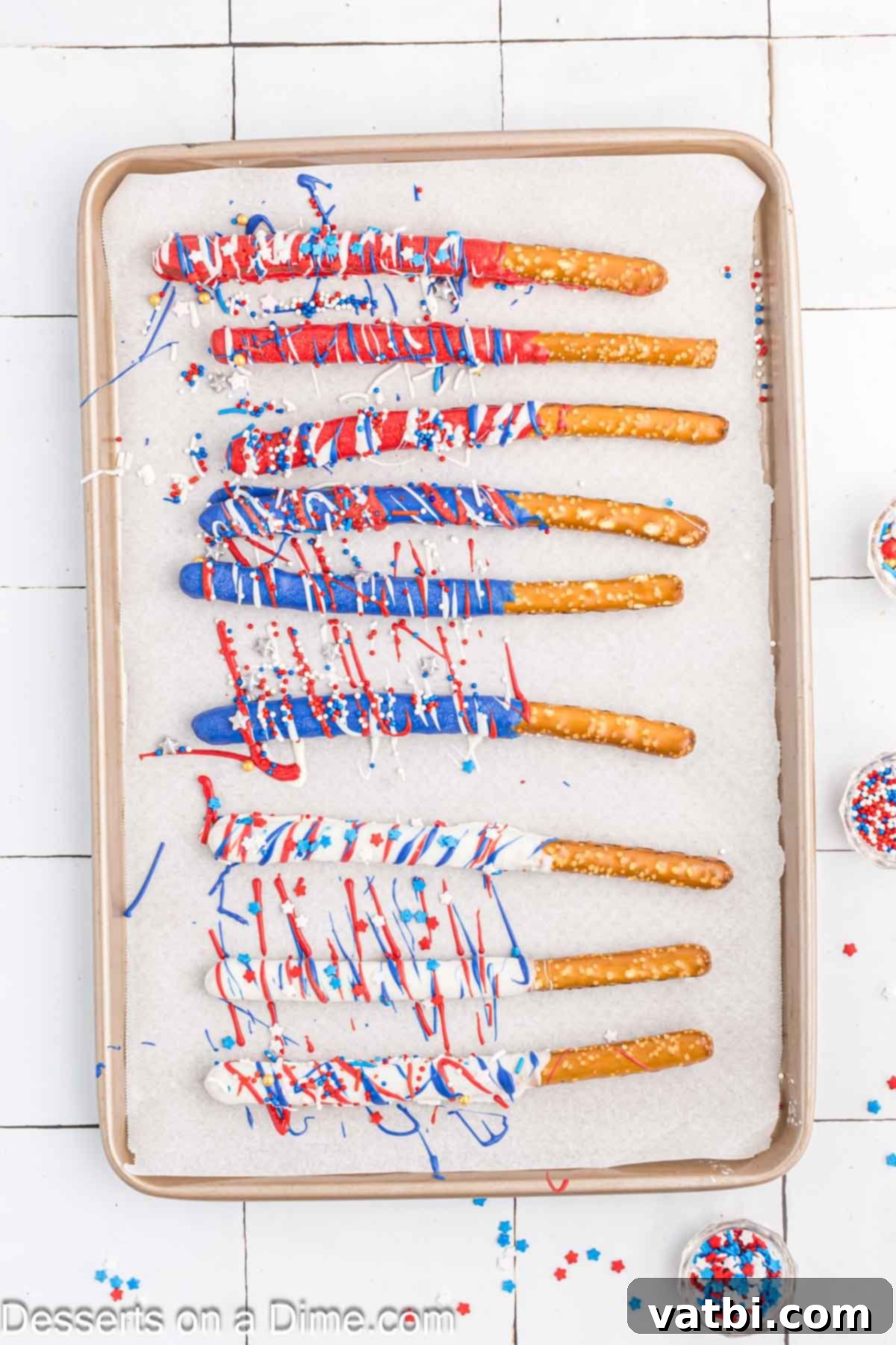 Red, White, and Sweet Pretzel Rods 4 Chocolate covered pretzel rods being drizzled with contrasting colored candy melts and sprinkled with patriotic stars.