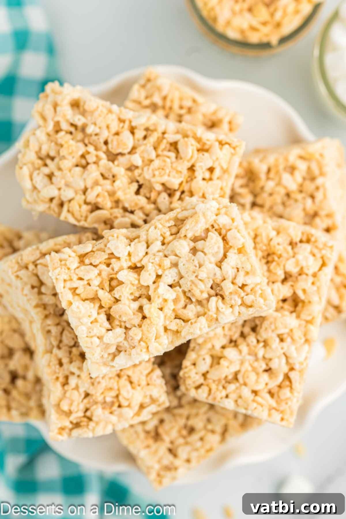 The Ultimate Rice Krispie Treat Recipe 2 Platter of homemade Rice Krispie Treats, perfectly cut into squares.