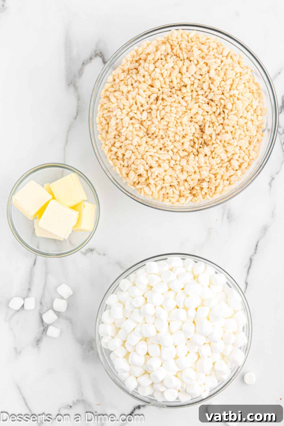 The Ultimate Rice Krispie Treat Recipe 3 Ingredients for making Rice Krispie Treats: a bowl of cereal, butter sticks, and a bag of marshmallows.