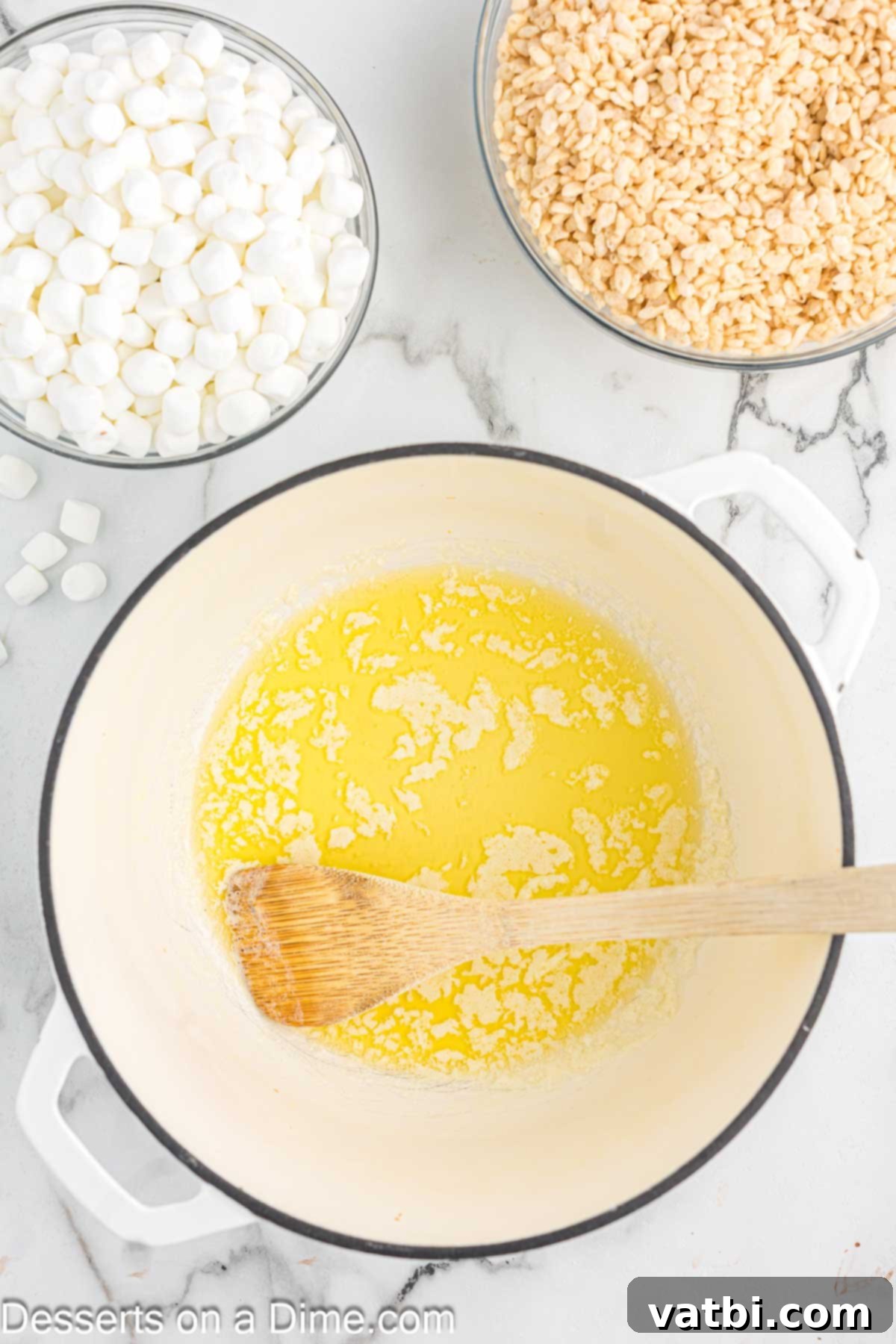 The Ultimate Rice Krispie Treat Recipe 4 Saucepan with melted butter, shimmering golden.