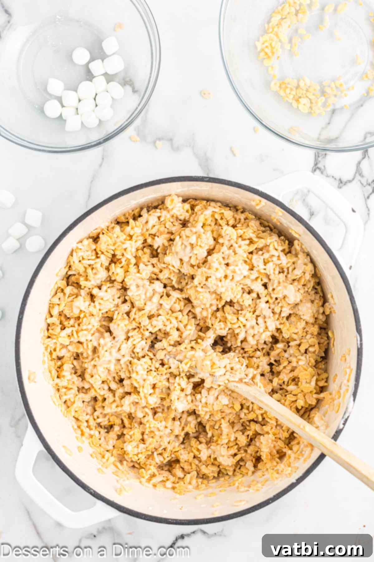 The Ultimate Rice Krispie Treat Recipe 8 Cereal and marshmallow mixture fully combined in a saucepan.