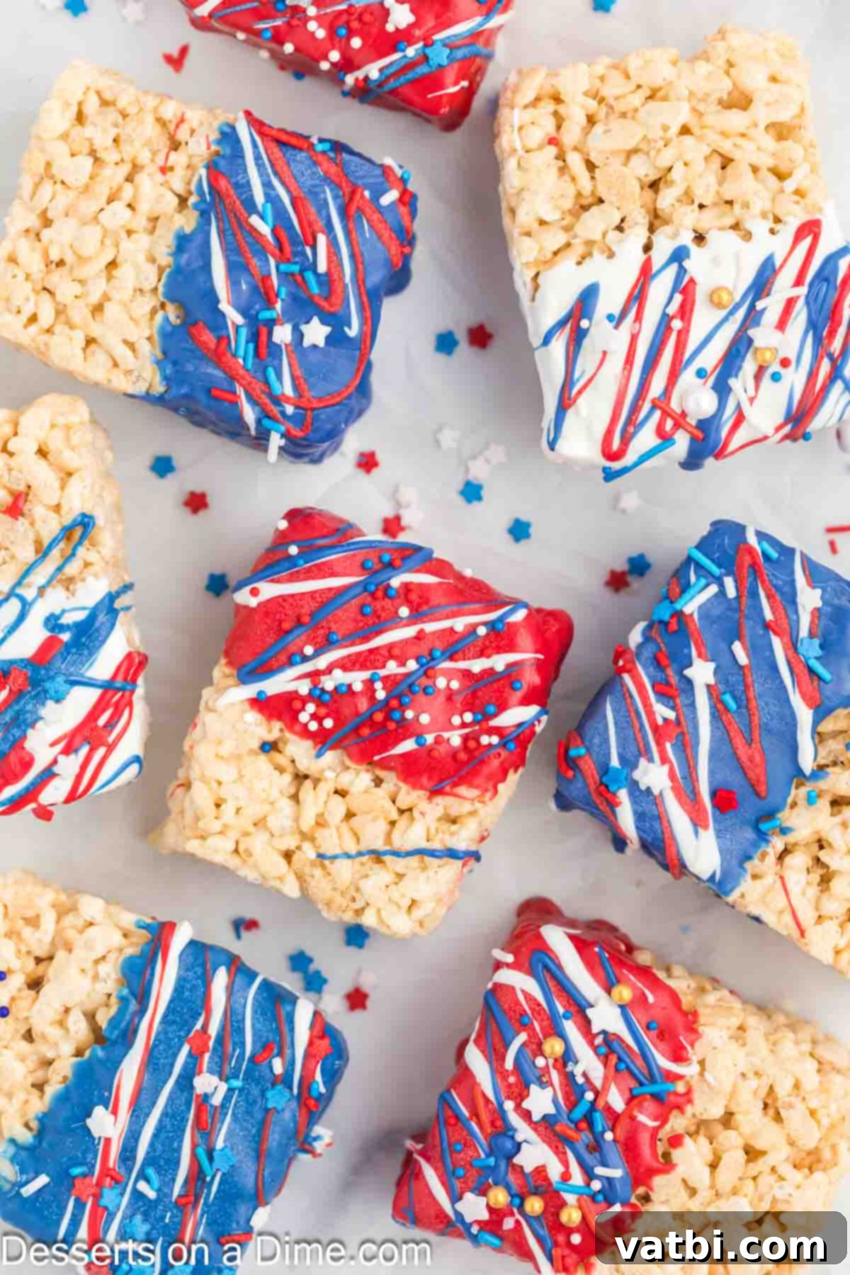 Patriotic Rice Krispie Delights 2 Delicious Red, White, and Blue Rice Krispie Treats topped with patriotic sprinkles, ready to serve.