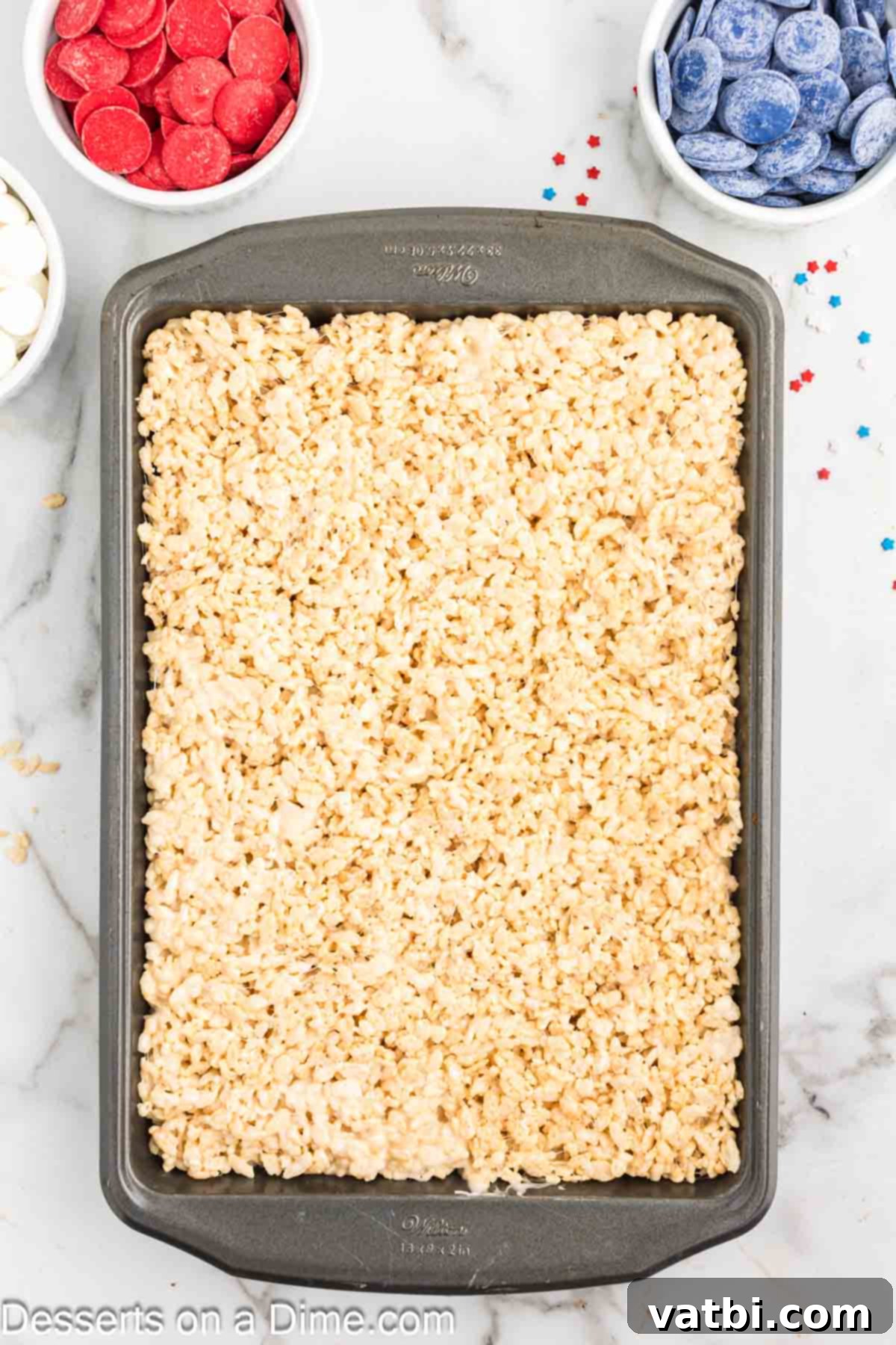 Patriotic Rice Krispie Delights 6 The Rice Krispie treat mixture pressed evenly into a baking dish.