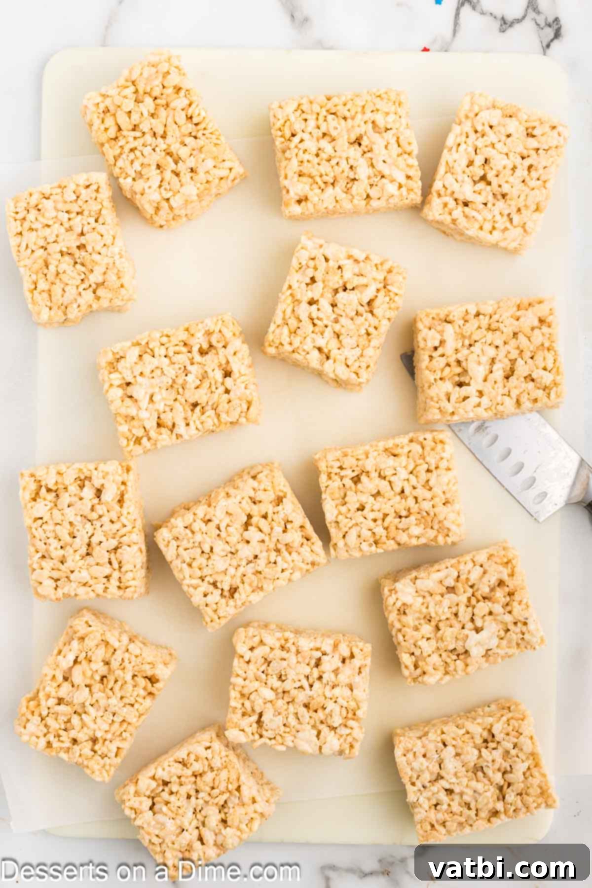 Patriotic Rice Krispie Delights 7 Cooled Rice Krispie Treats cut into uniform rectangle bars.