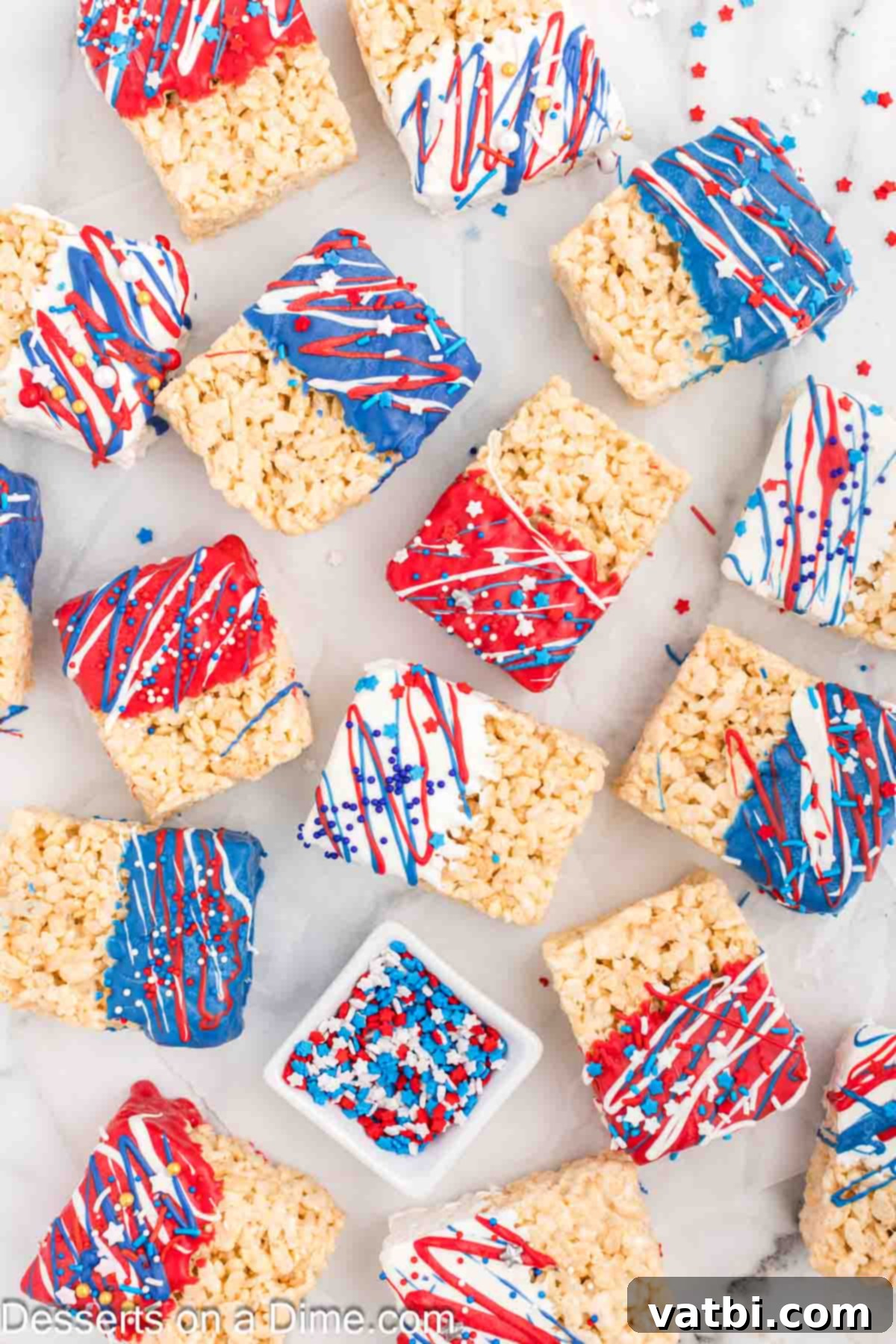 Patriotic Rice Krispie Delights 9 Dipped Rice Krispie Treats decorated with star sprinkles and drizzled with contrasting candy melt colors.