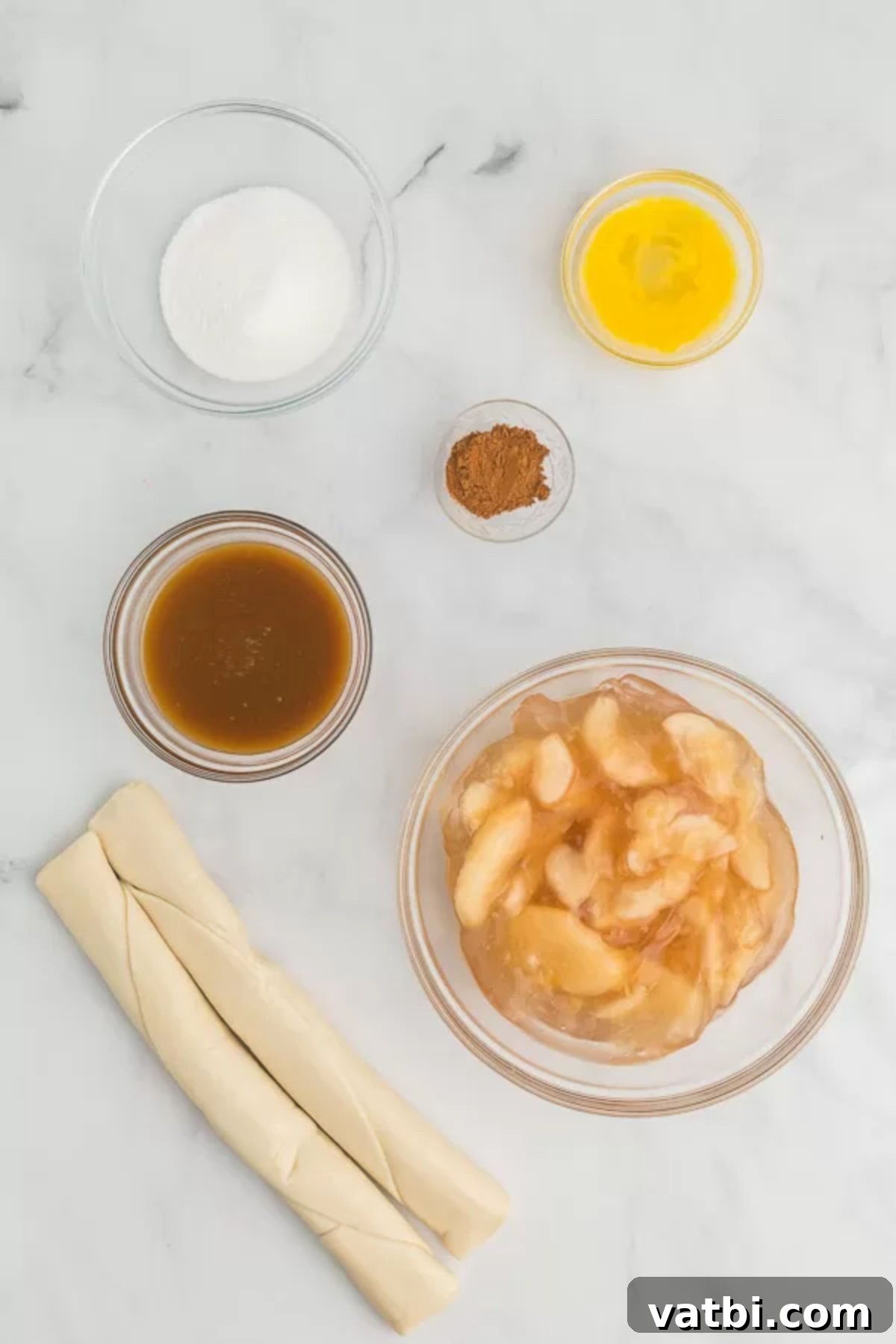 Apple Pie Stuffed Cookies 3 Ingredients for easy apple pie cookies including apple pie filling, pie crusts, salted caramel sauce, egg, and cinnamon.