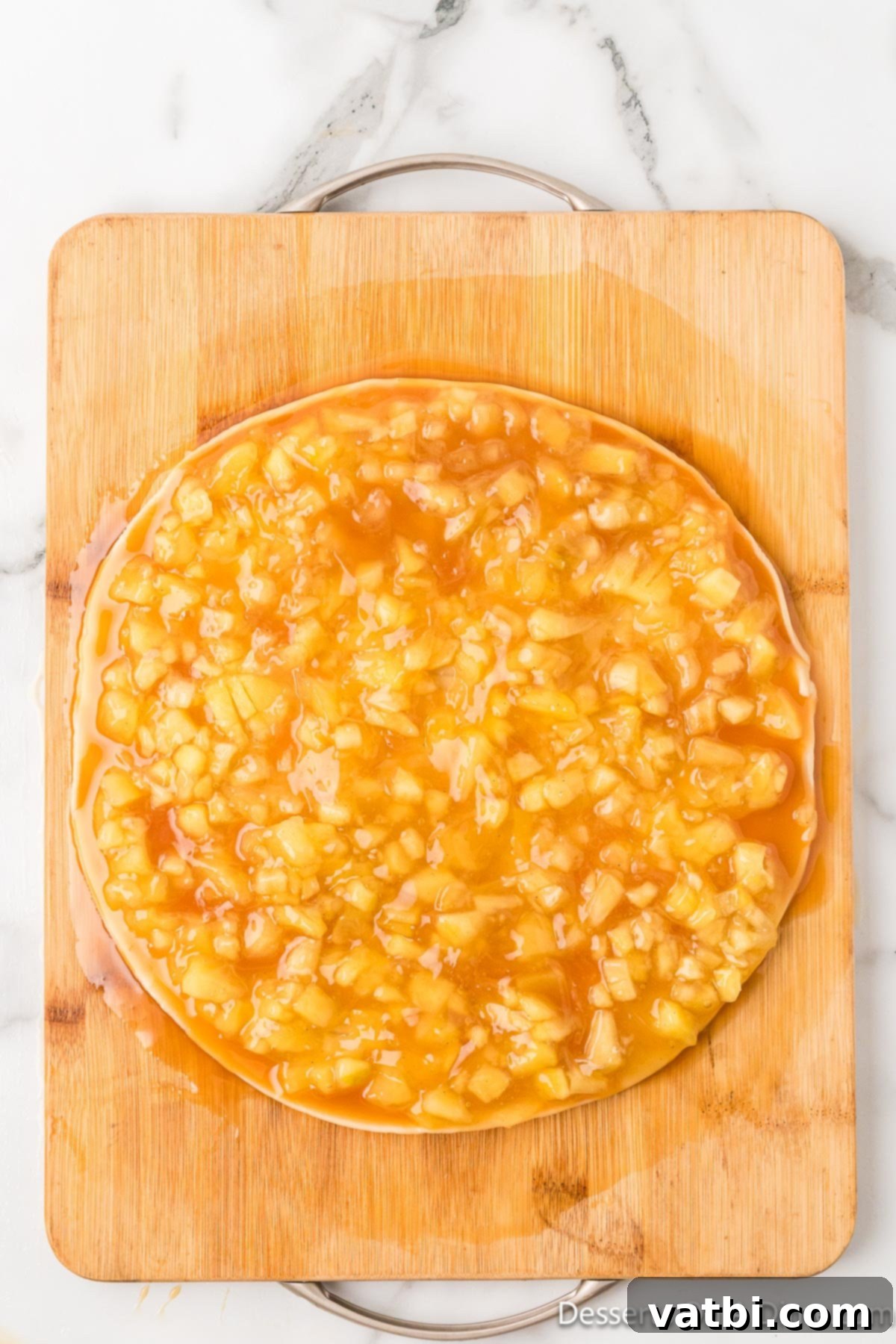 Apple Pie Stuffed Cookies 5 Salted caramel sauce and chopped apple pie filling spread evenly on a rolled-out pie crust.