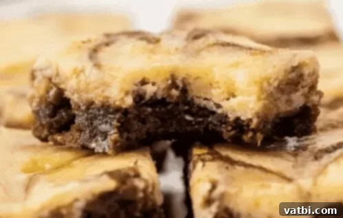 Sweet Surprises for Super Dads 4 Easy Cheesecake Brownies, showing swirls of cheesecake within the brownie.