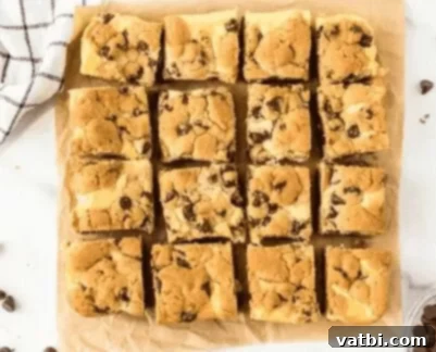 Sweet Surprises for Super Dads 8 Chocolate Chip Cheesecake Bars on a serving tray, showing their distinct layers.