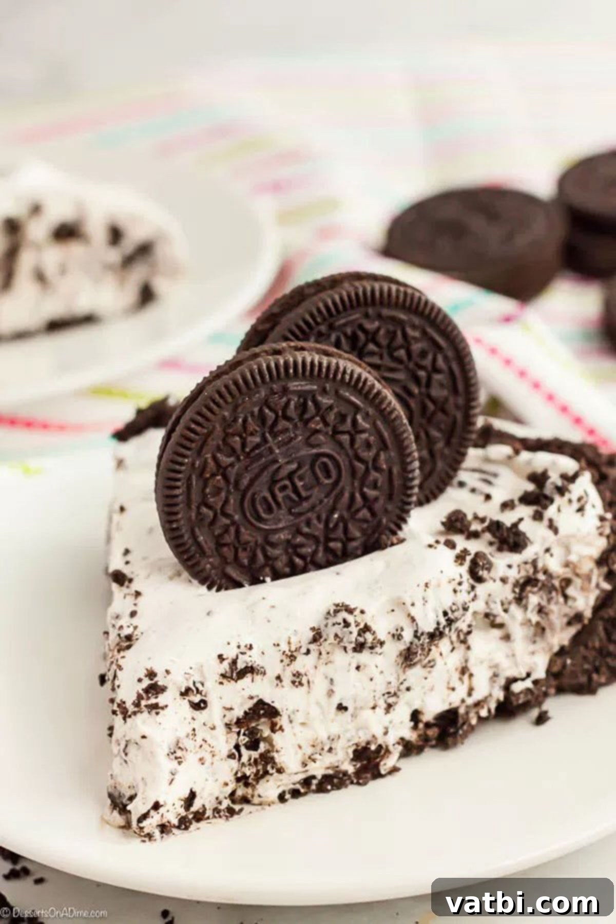 No Bake Oreo Pie Recipe is one of our favorite no bake treats. Everyone loves Oreo cookies so a pie seemed like a great idea! It is so creamy and delicious. A slice of creamy No-Bake Oreo Pie with whole Oreo cookies perched on top, ready to be enjoyed.