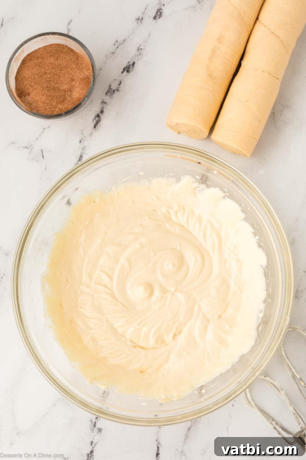 Cinnamon Sugar Cheesecake 6 The smoothly combined cream cheese filling in a bowl, showing its creamy and lump-free consistency.