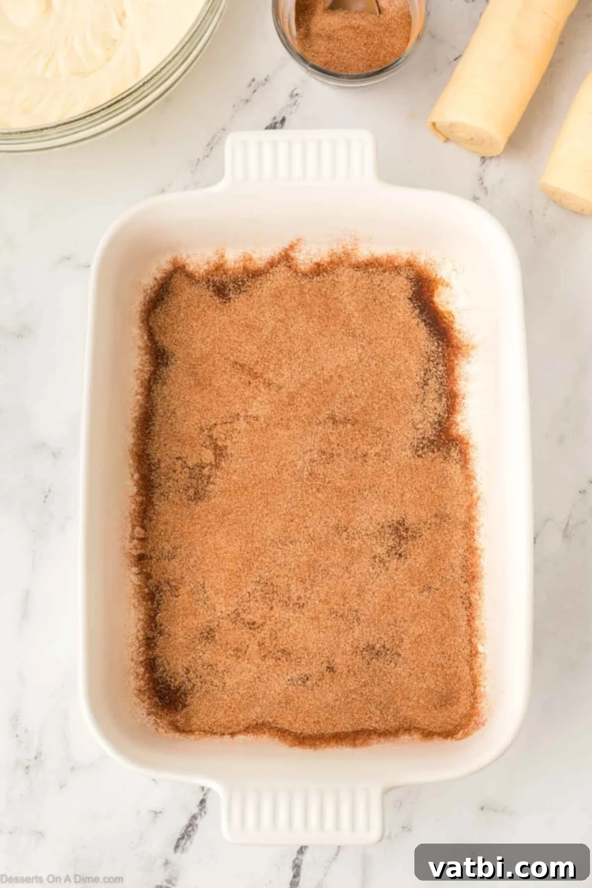 Cinnamon Sugar Cheesecake 8 Half of the cinnamon sugar mixture evenly sprinkled across the bottom of the prepared 9x13 inch baking pan.