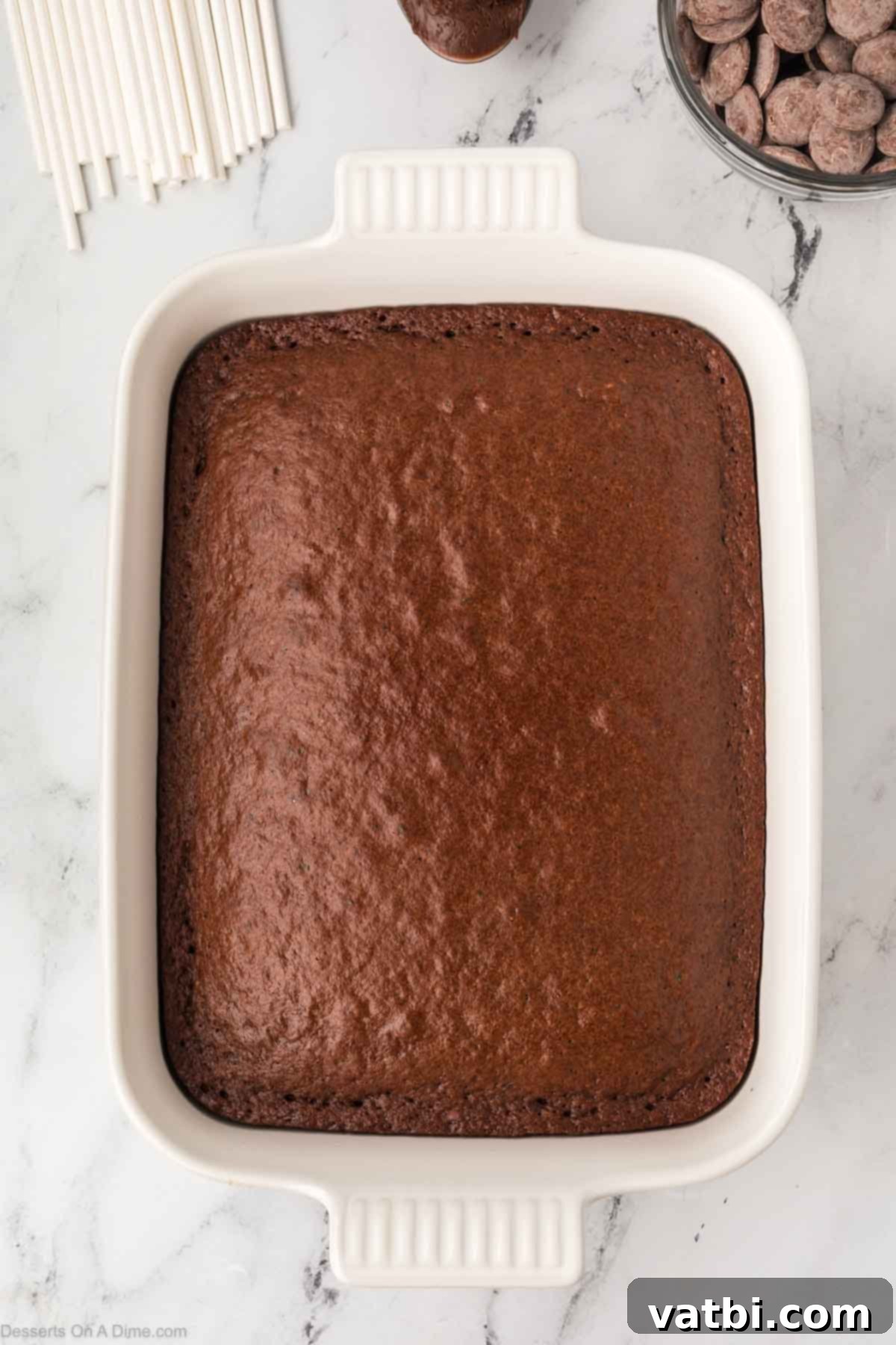 Copycat Starbucks Chocolate Cake Pops 4 A freshly baked chocolate cake cooling in a 9x13 inch baking pan.