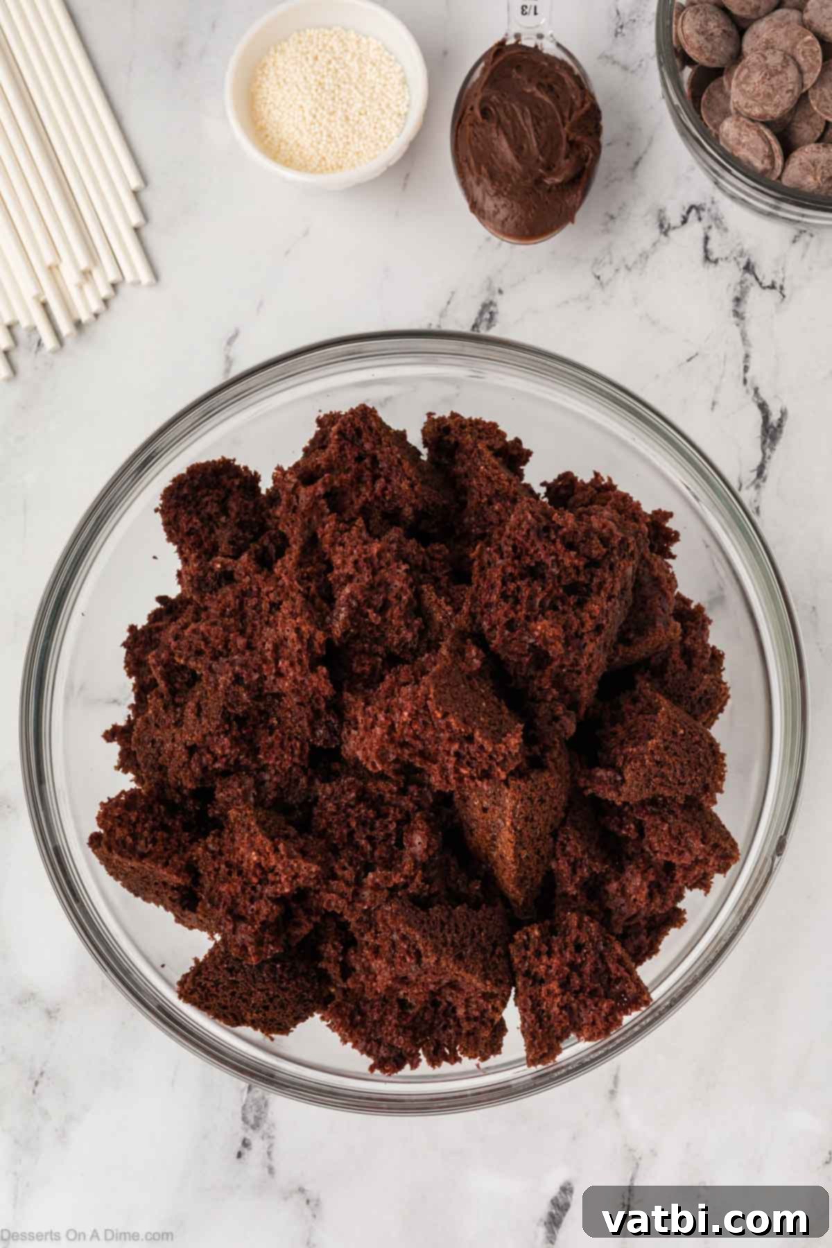 Copycat Starbucks Chocolate Cake Pops 7 The soft inner chocolate cake is crumbled into fine pieces in a large mixing bowl.