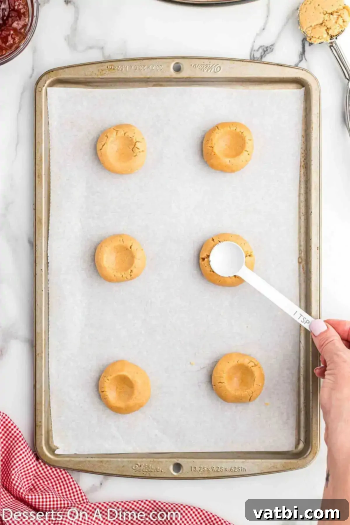 PB&J Cookie Perfection 8 Cookies pressed down to create an indentation for jam filling.