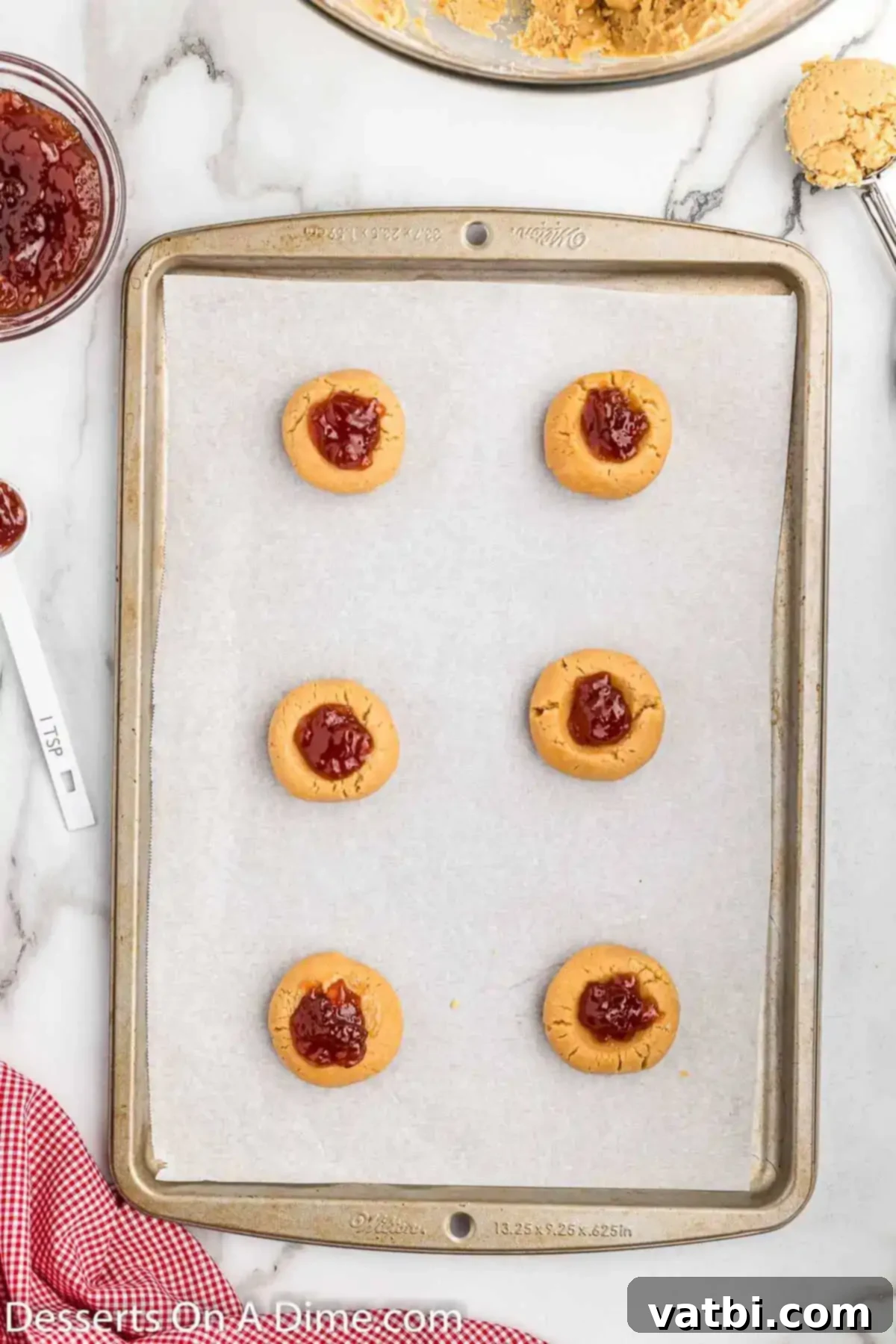 PB&J Cookie Perfection 9 Each cookie topped with a generous dollop of strawberry jam.