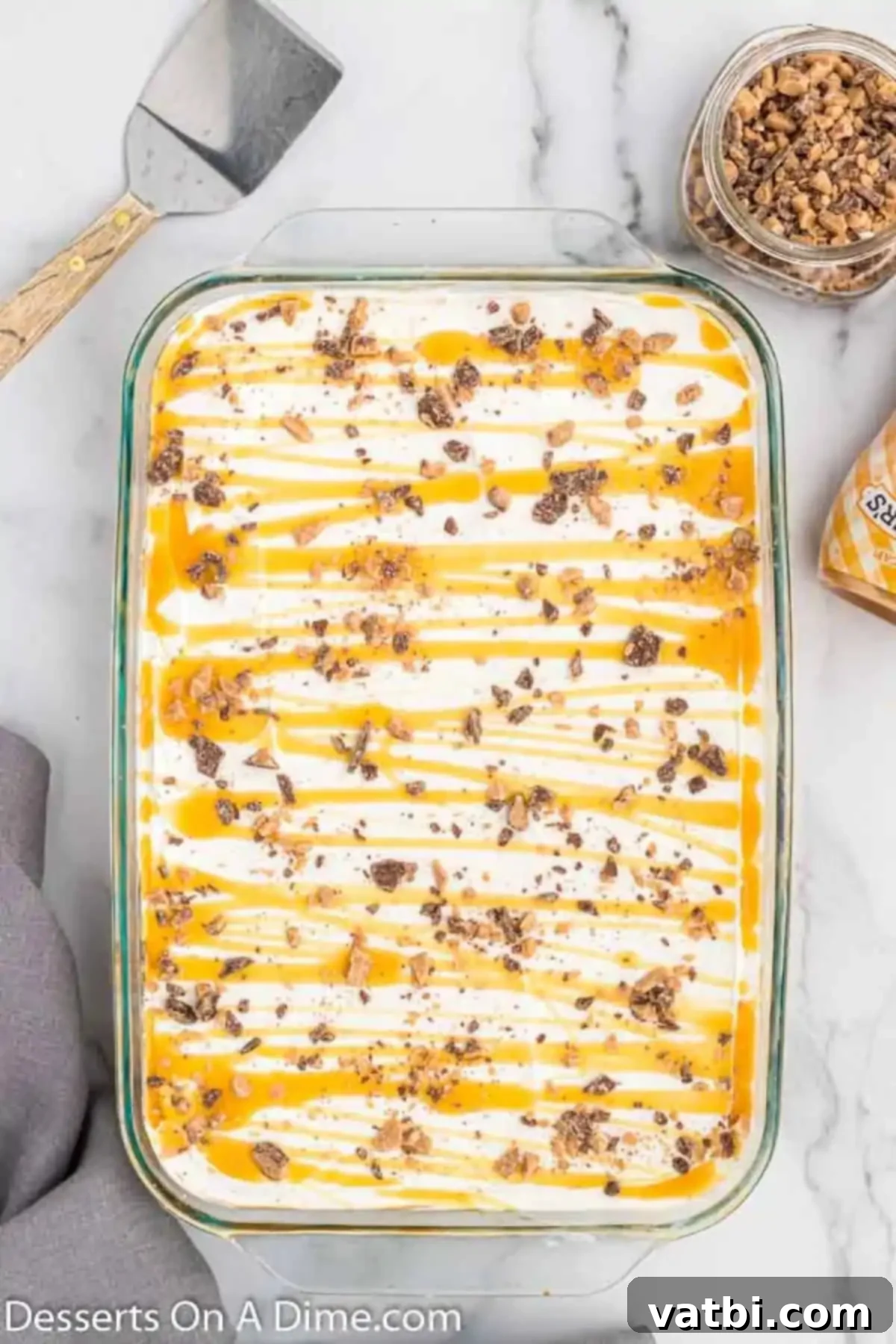 Butterscotch Bliss 9 Cool whip, candy and butterscotch spread on top.