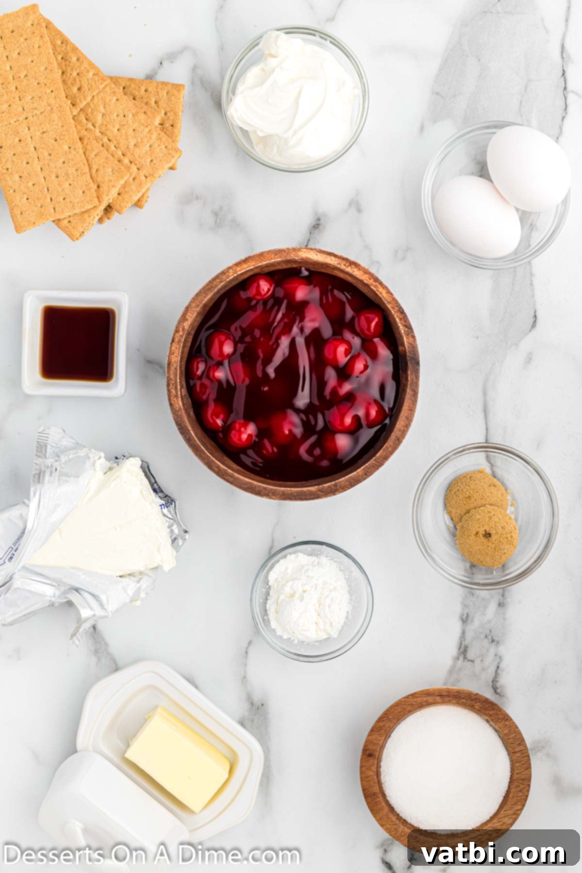 Instant Pot Cheesecake Perfection 3 A flat lay photograph showcasing all the ingredients required for Instant Pot cheesecake recipe.