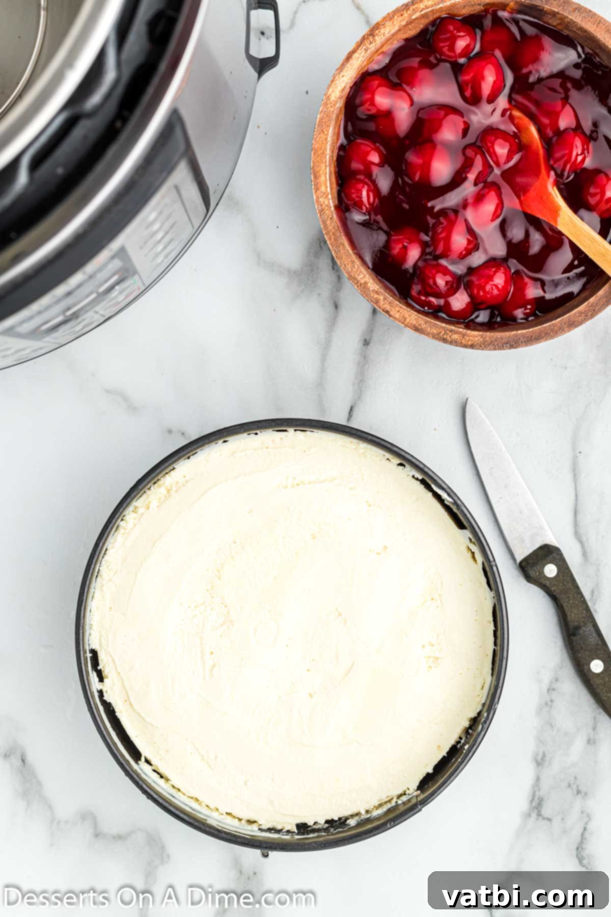 Instant Pot Cheesecake Perfection 8 Freshly cooked Instant Pot cheesecake cooling on a wire rack after natural pressure release.