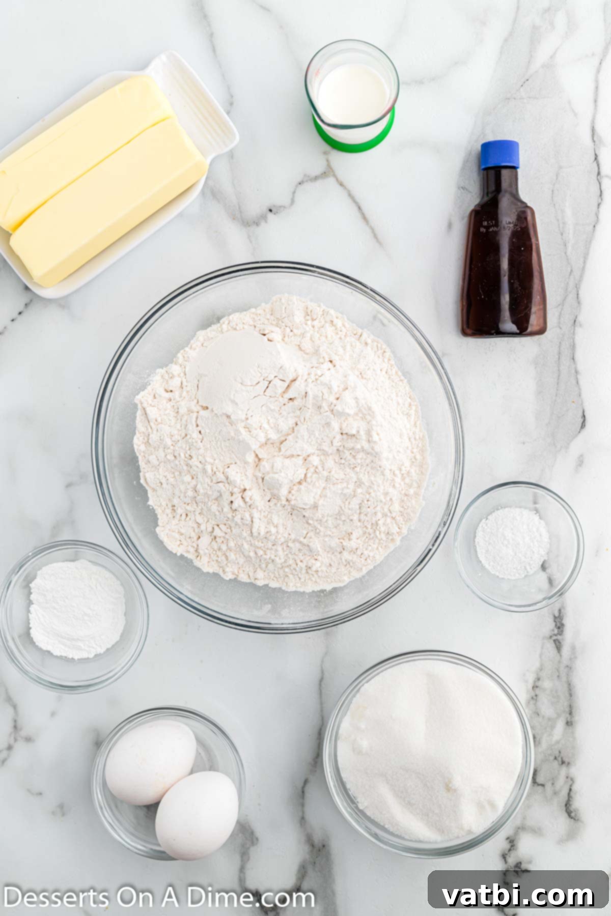 Homestyle Sugar Cookies 3 Collection of ingredients for Old Fashioned Sugar Cookies including butter, large eggs, vanilla extract, milk, and flour.