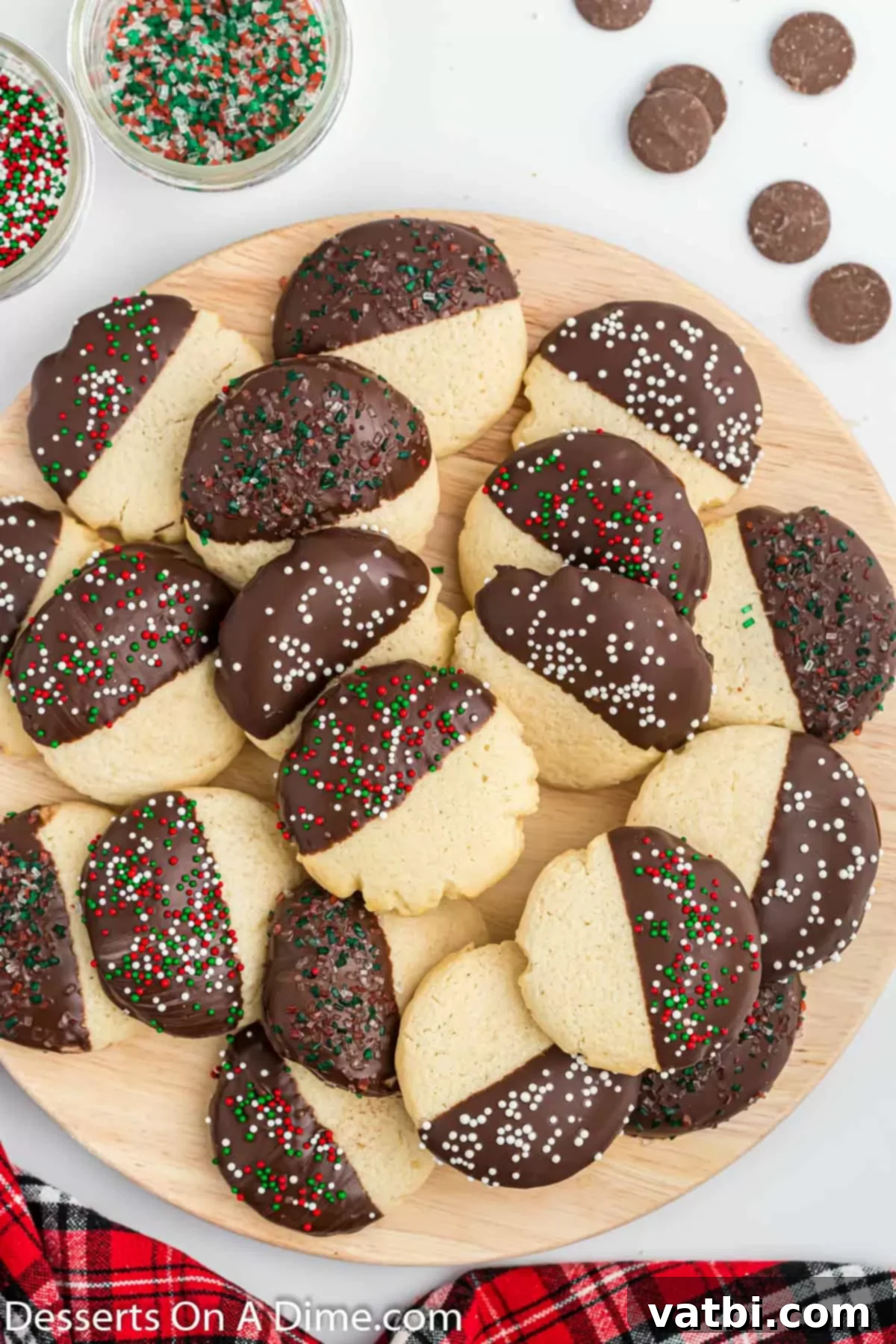 Irresistible Chocolate Dipped Sugar Cookies 10 A festive platter filled with chocolate dipped sugar cookies, ready for serving.