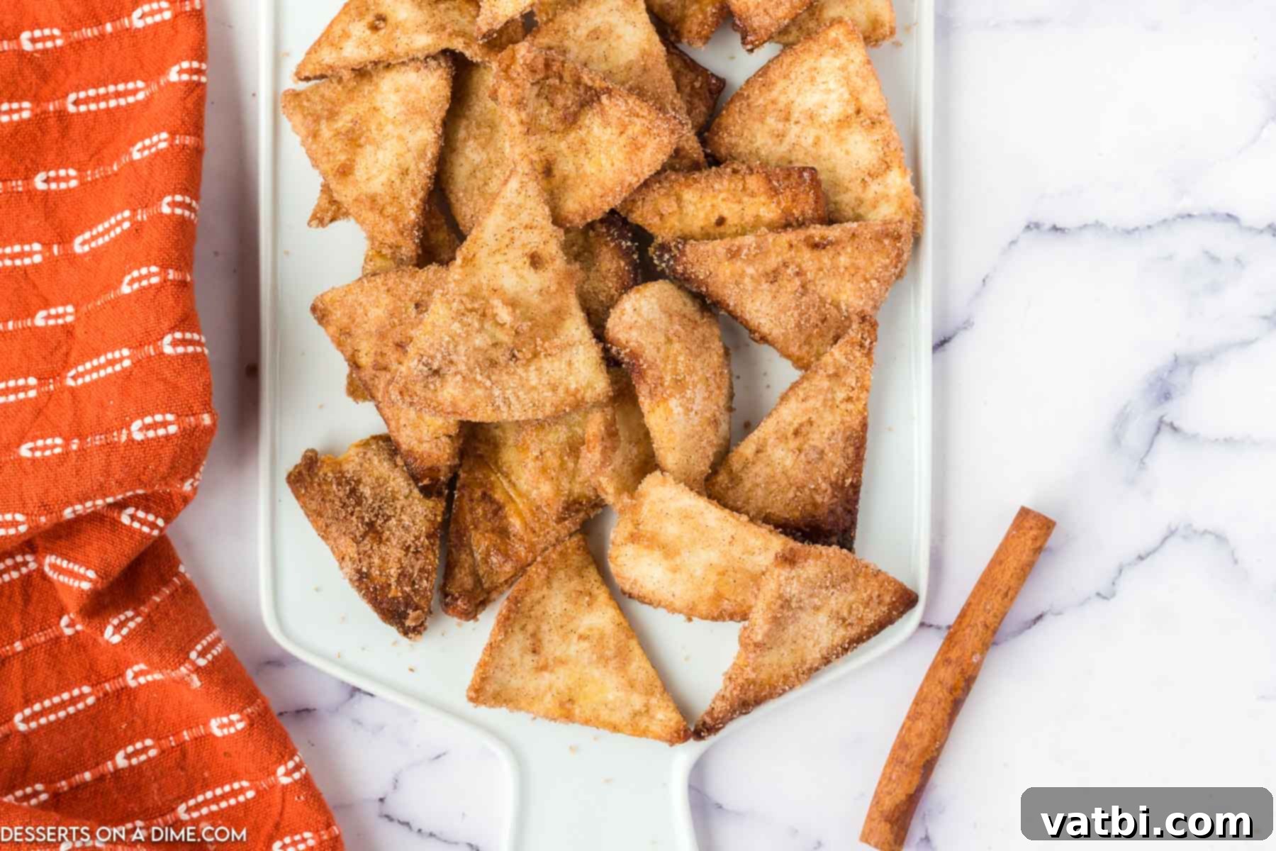 A close-up shot of Air Fryer Churro Chips with a rich caramel dip, highlighting their enticing texture and deliciousness.
