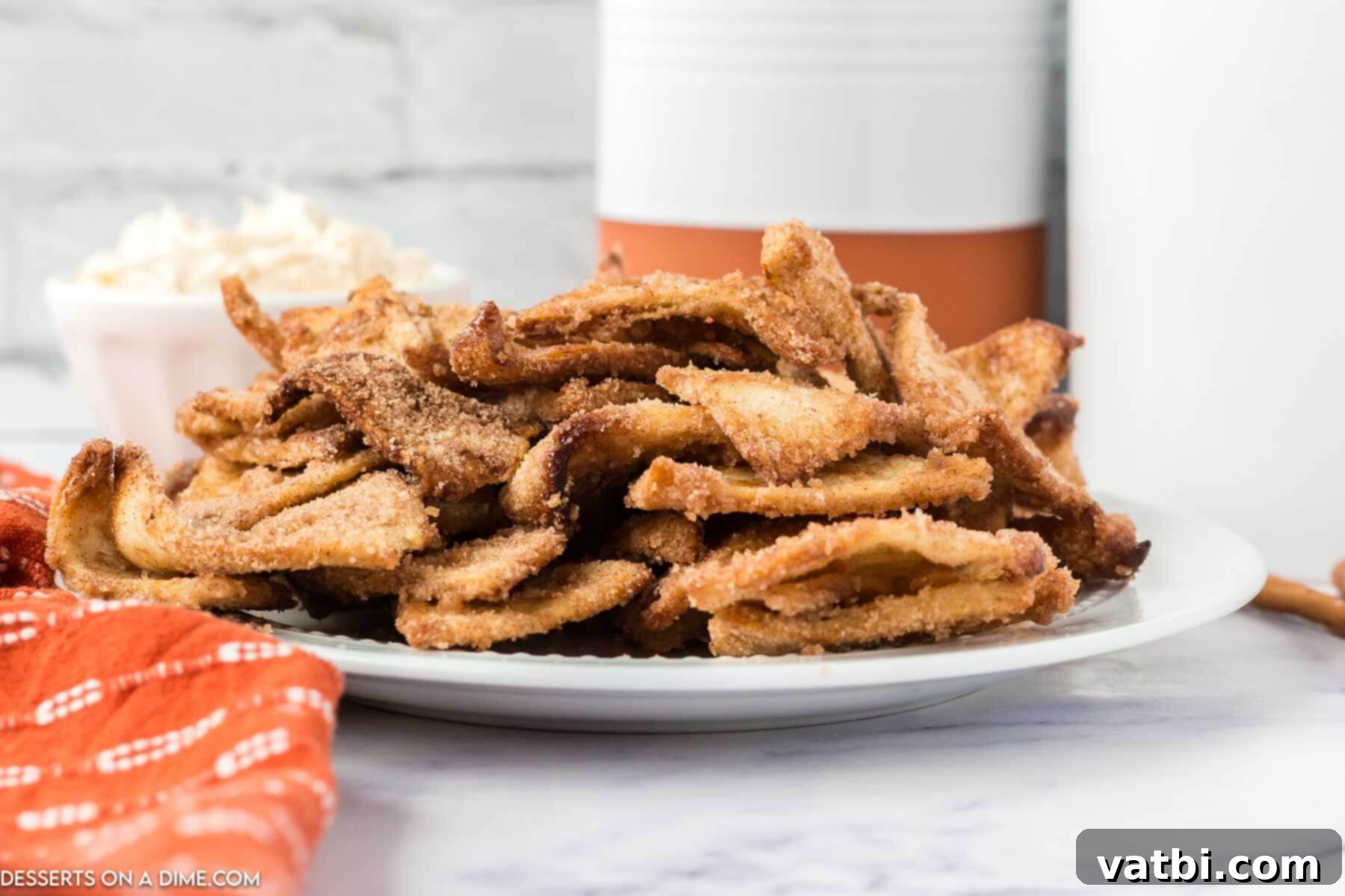 An overhead view of Air Fryer Churro Chips on a serving platter, showing their perfect golden-brown color and appealing texture.
