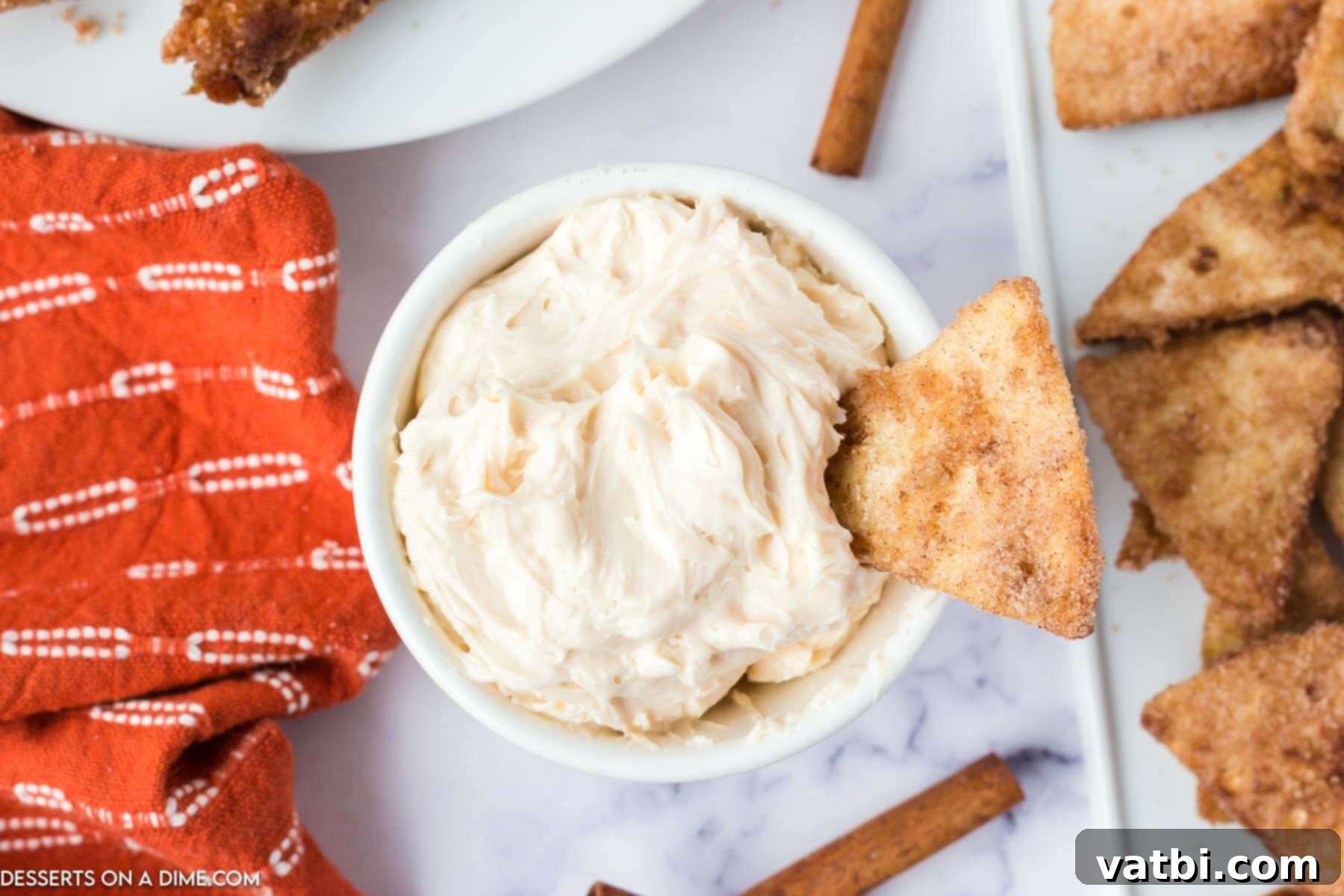 Silky Smooth Caramel Dip 2 A bowl of creamy caramel apple dip, garnished with cinnamon chips, ready for serving.