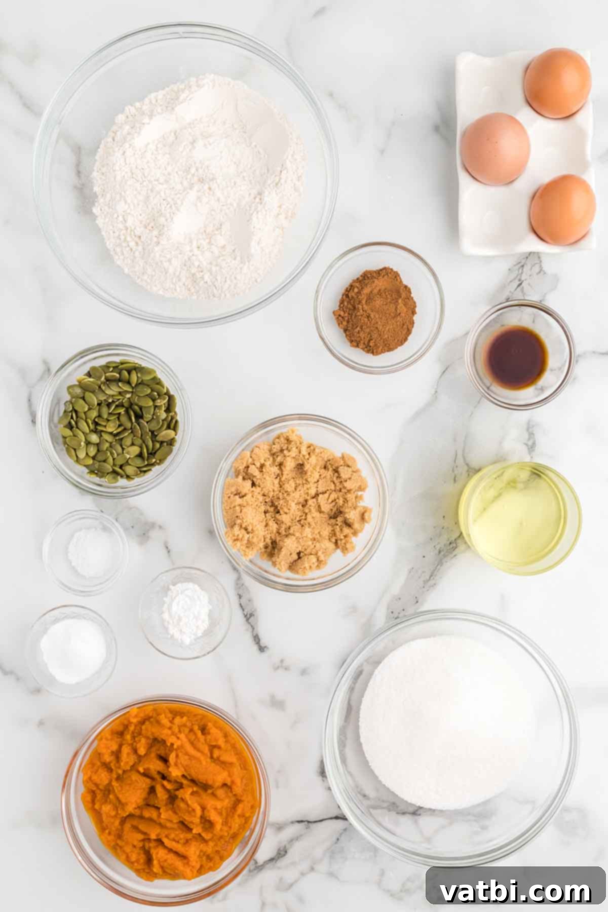 Ingredients for Starbucks pumpkin bread - flour, baking soda, pumpkin puree, brown sugar, eggs, vanilla, pepitas. 