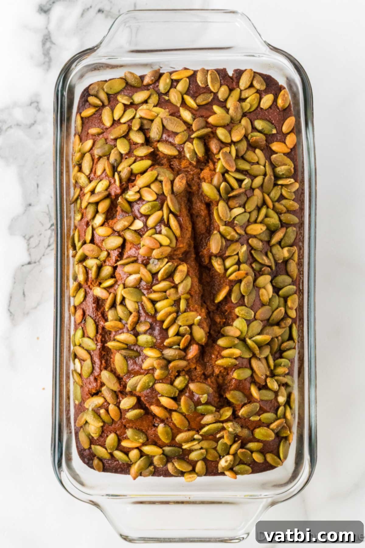 Pumpkin Bread baked until golden brown and cooling in pan. 
