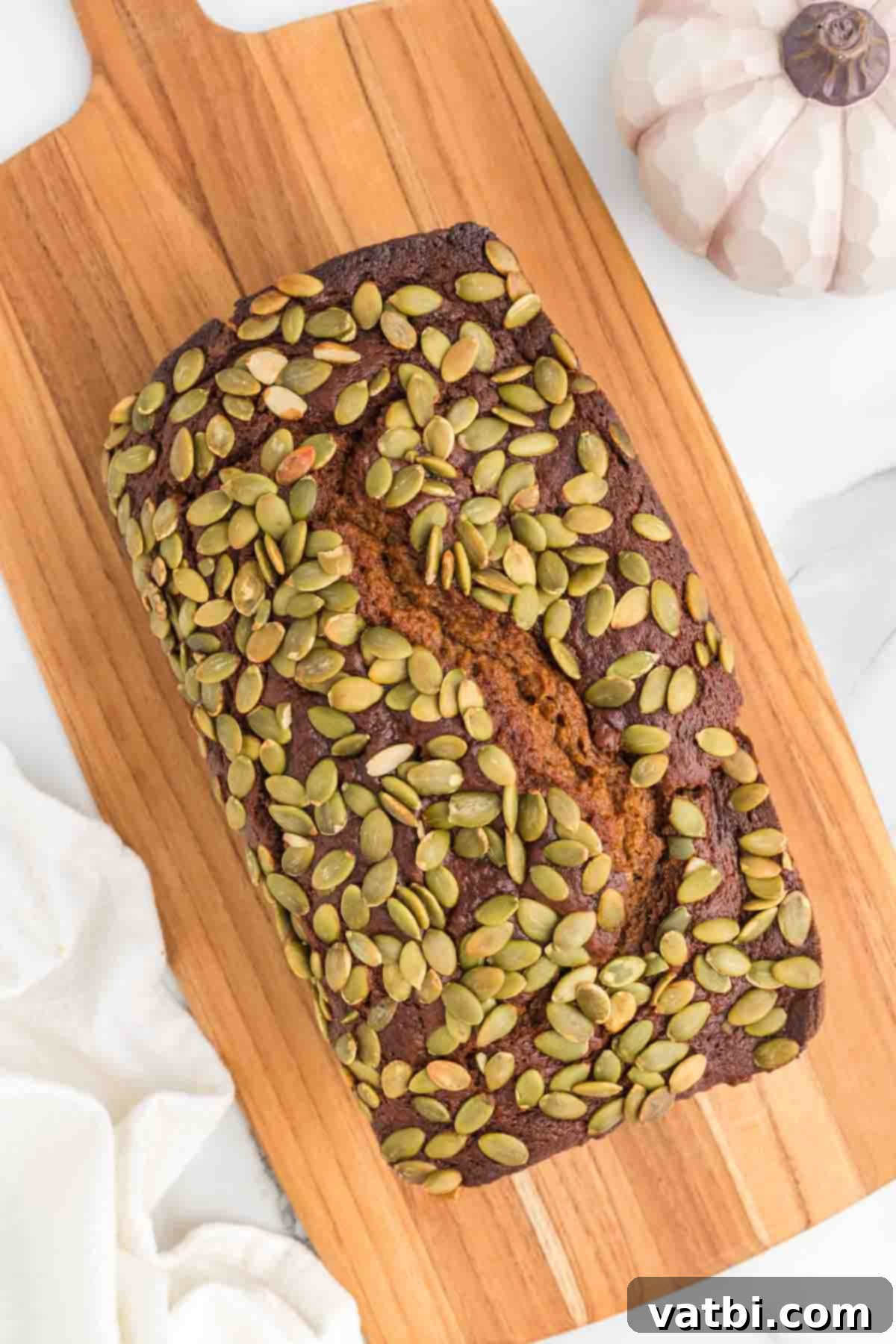Starbucks pumpkin bread on a cutting board. 