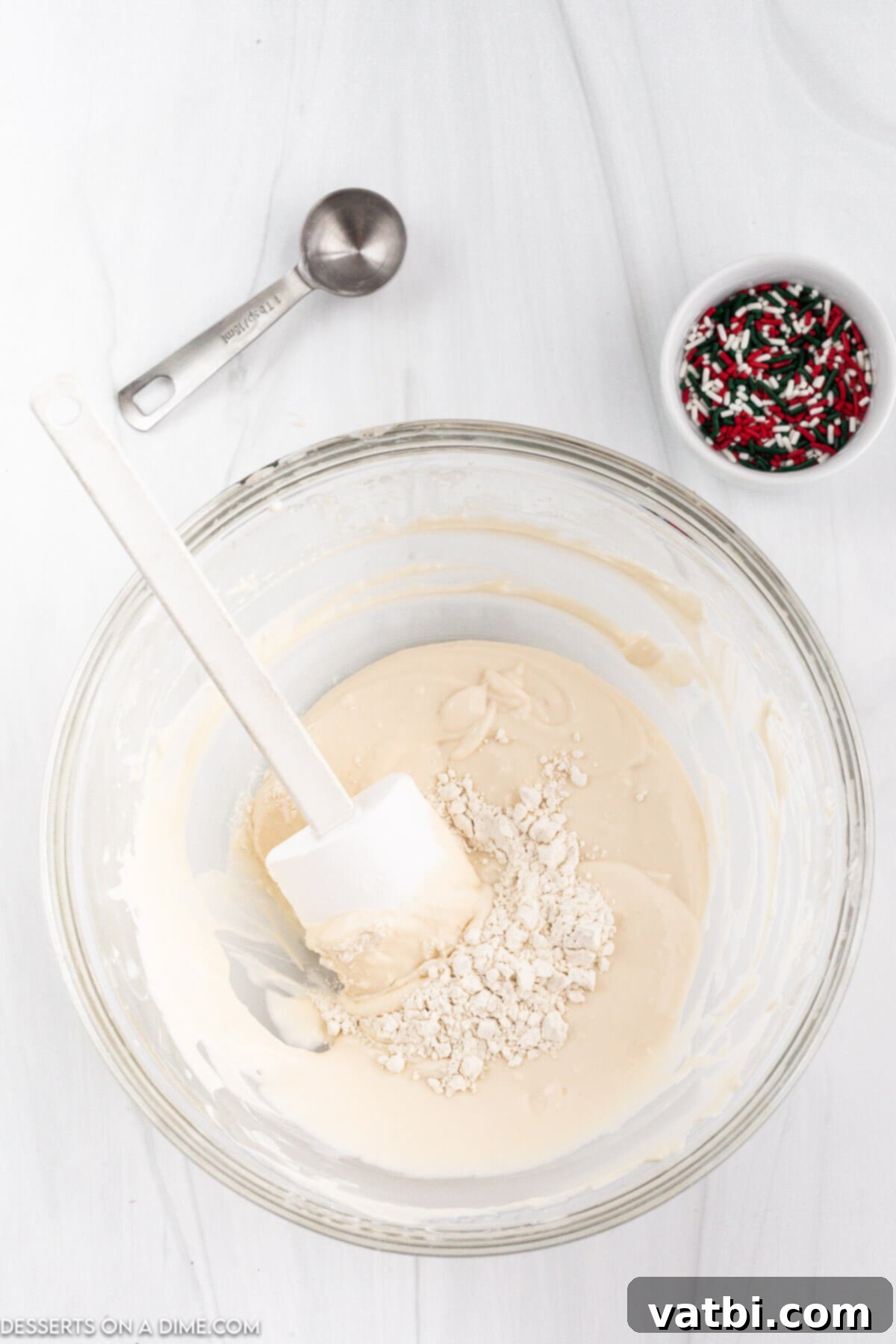 Santa's Favorite Cookie Dip 4 Step 1: Beating softened butter, cream cheese, and powdered sugar until light and fluffy.