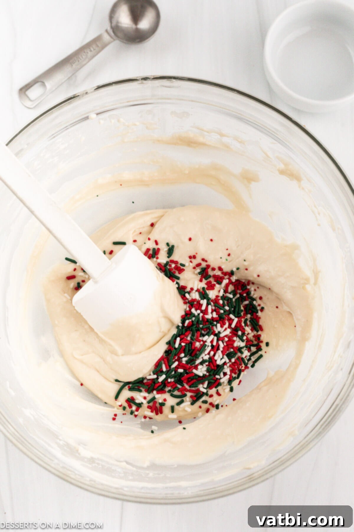 Santa's Favorite Cookie Dip 5 Step 2: Mixing in flour and vanilla extract into the creamy dip base.