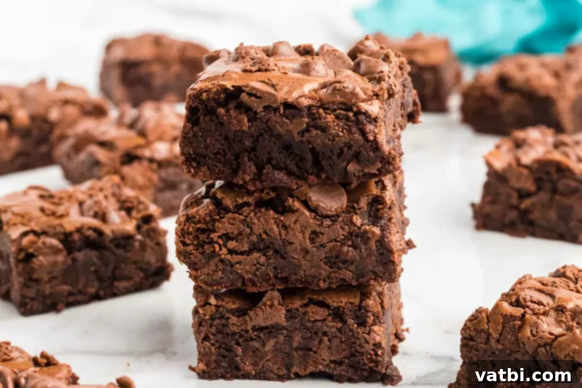 Recreate Starbucks' Famous Brownies at Home 8 Close up photo of Starbucks brownies cut into squares.