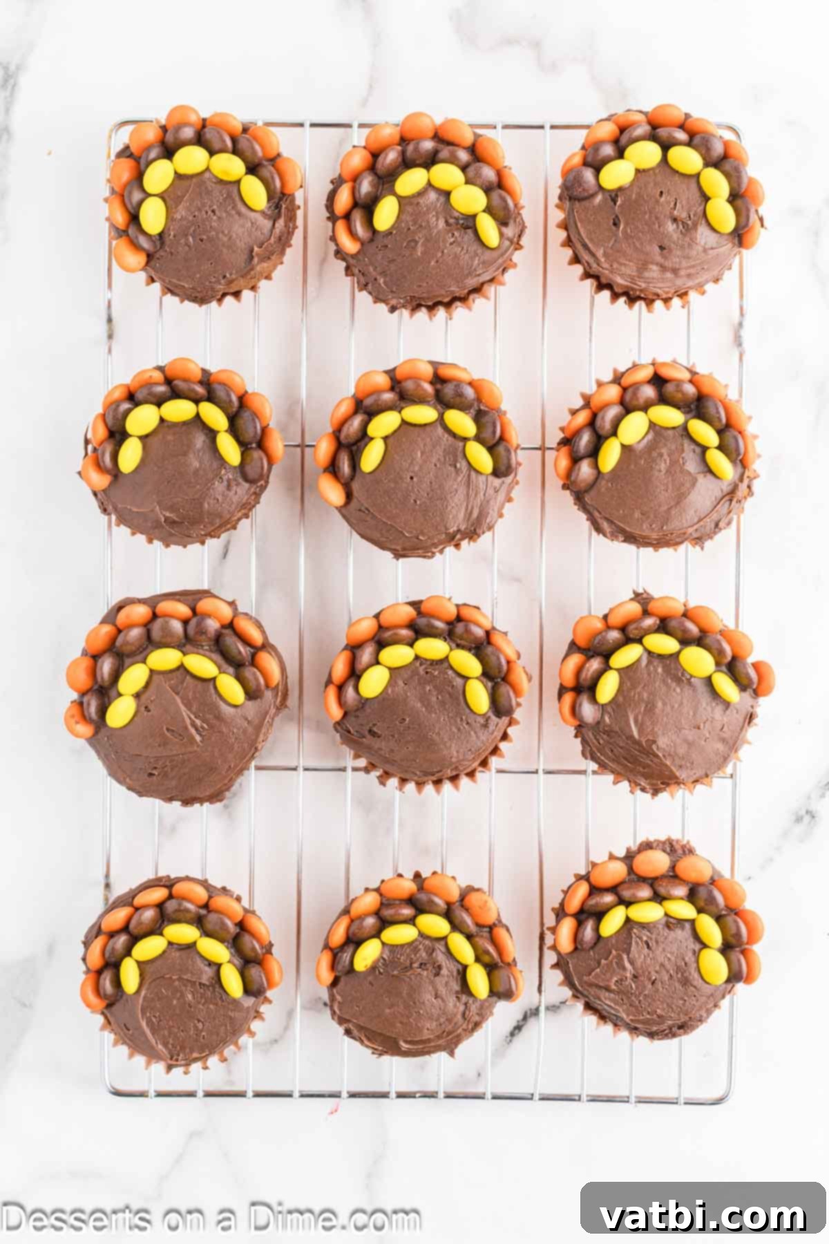 Cupcake topped with reese's pieces. 