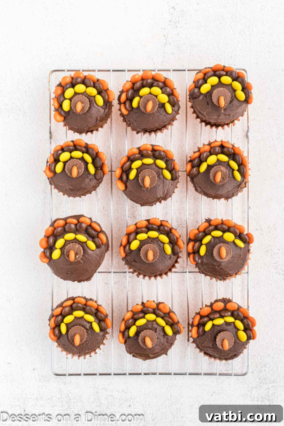 Cupcake with orange reese's cut in half and added. 