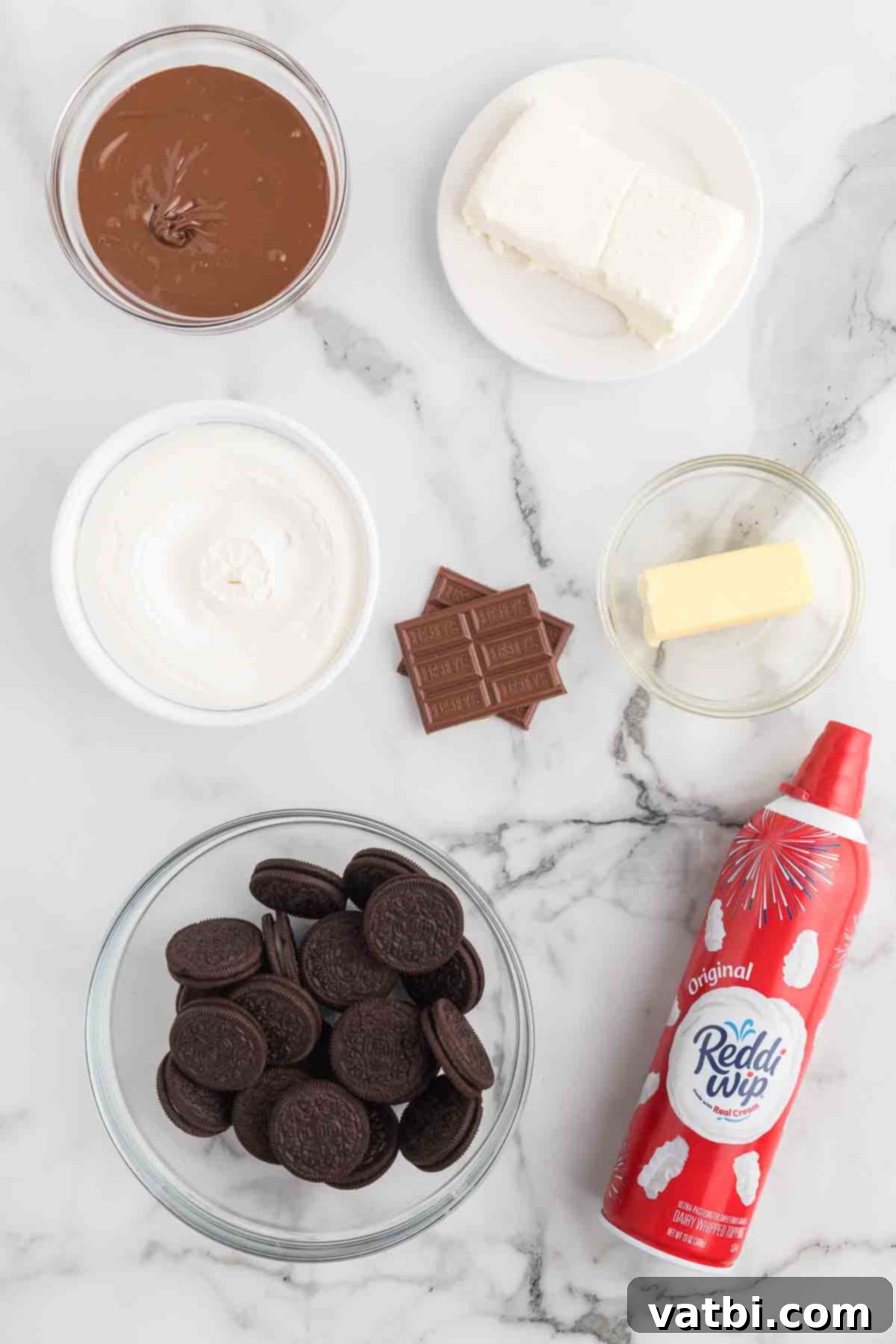 Irresistible Nutella Pie 3 Ingredients for nutella pie- chocolate, oreo cookies, whipped cream, butter, cream cheese, milk chocolate.