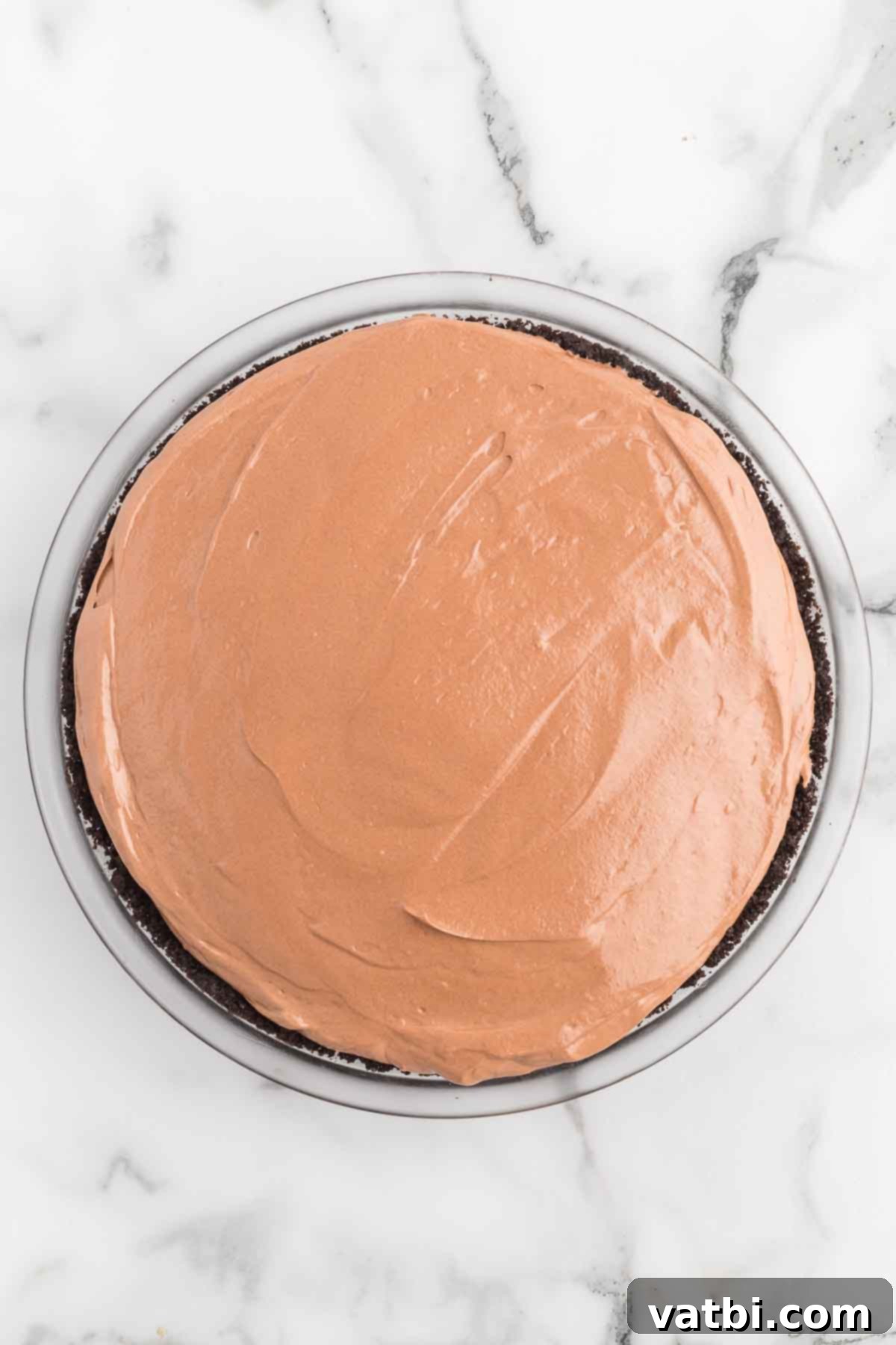 Irresistible Nutella Pie 9 Filling poured into pie crust.