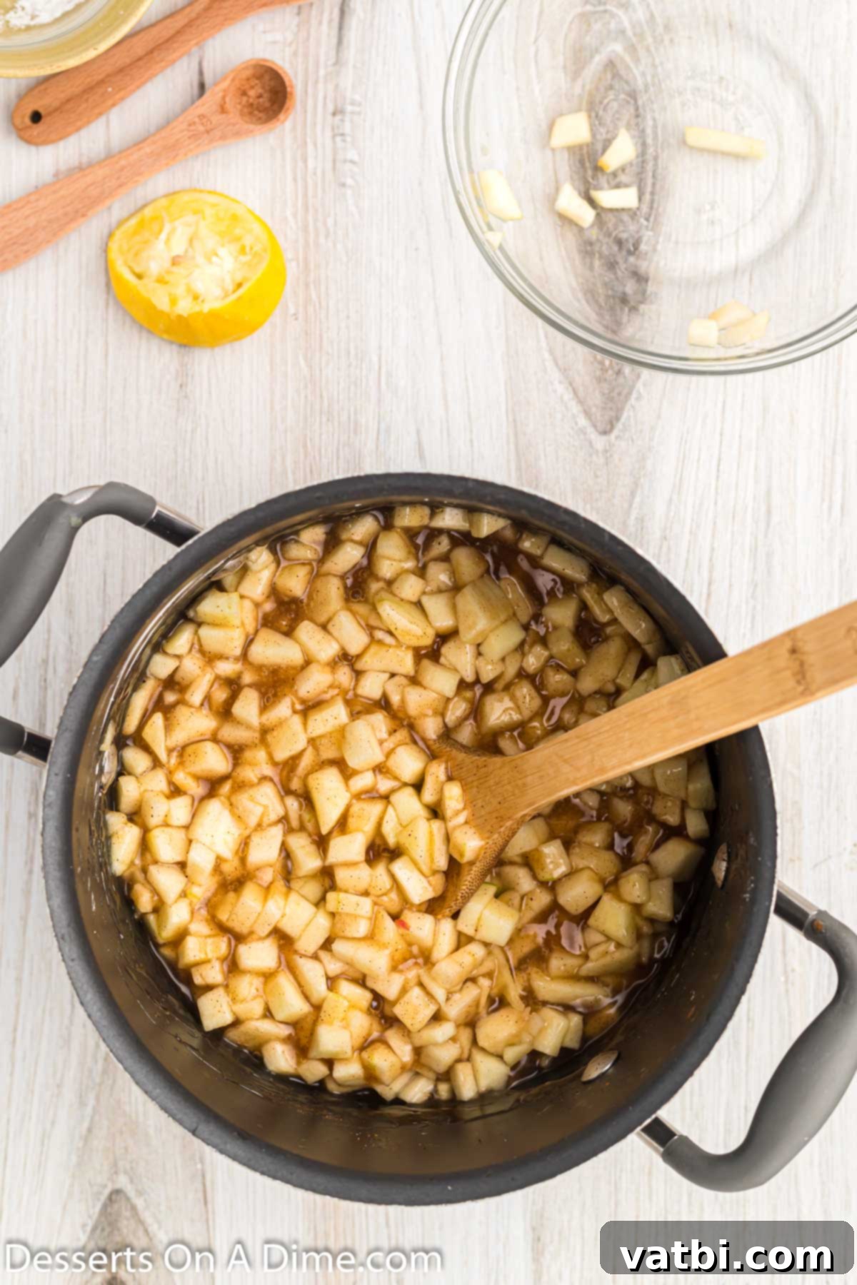 Apple Pie Poppers 7 Diced apples added to the simmering spice mixture in the saucepan.