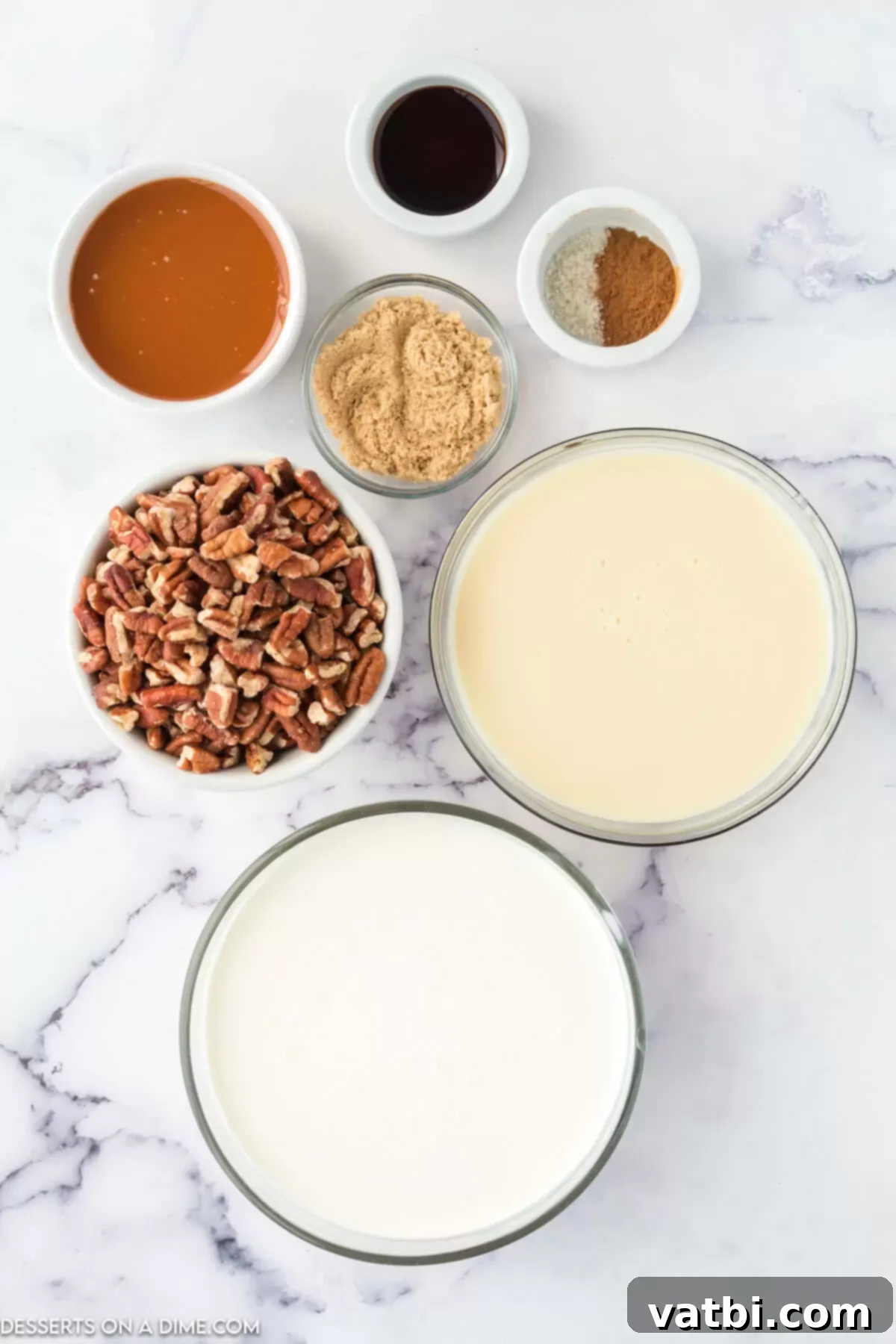 Ingredients for Caramel Pecan Praline Ice Cream recipe - heavy cream, sweetened condensed milk, pecans, brown sugar, cinnamon, caramel sauce.