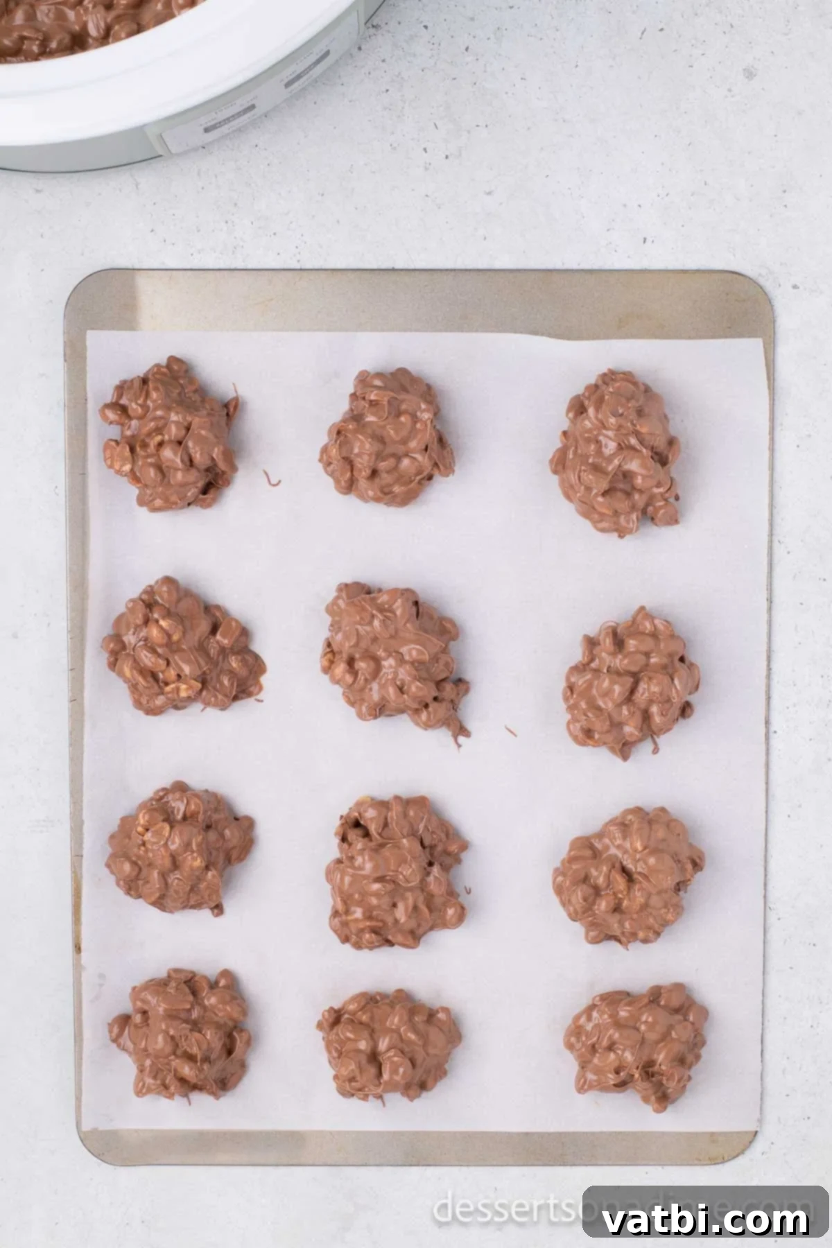 Candy scooped into mounds on baking sheet.