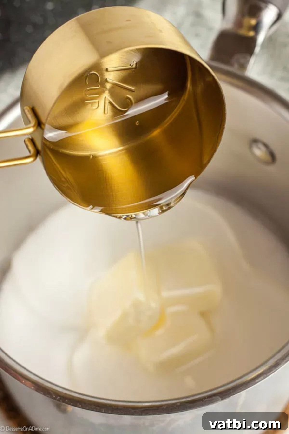Golden Popcorn Delights 3 The corn syrup, sugar, butter, and salt mixture being heated in a saucepan on the stovetop.