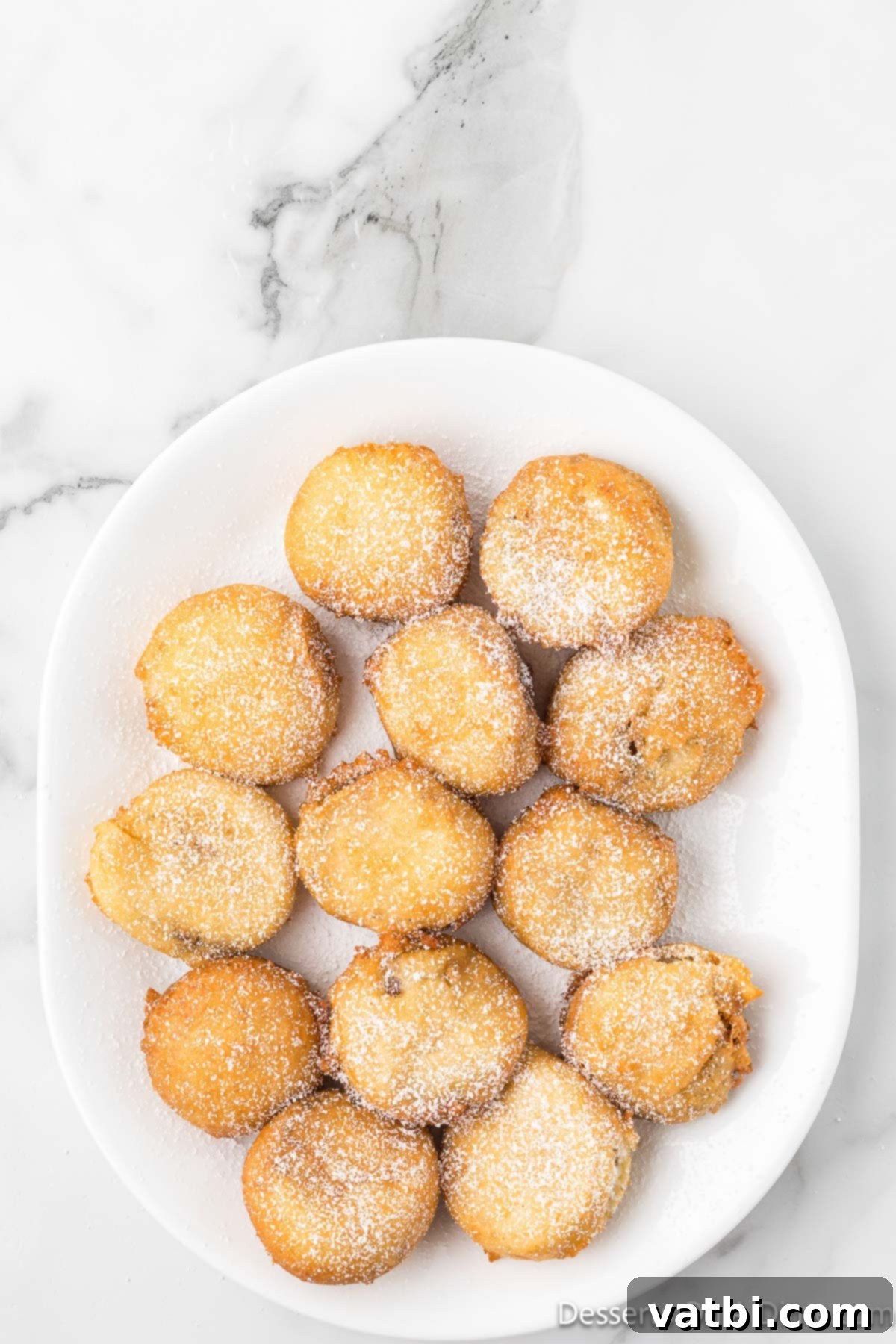 Deep Fried Peanut Butter Bliss 11 Powdered sugar sprinkled generously on top of fried Reese's cups.