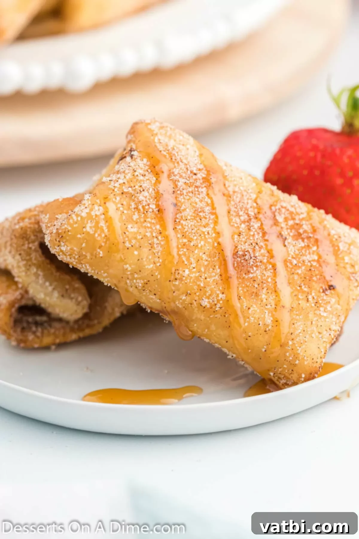 Crispy Cheesecake Dessert Chimis 11 Cheesecake chimichangas on a platter.